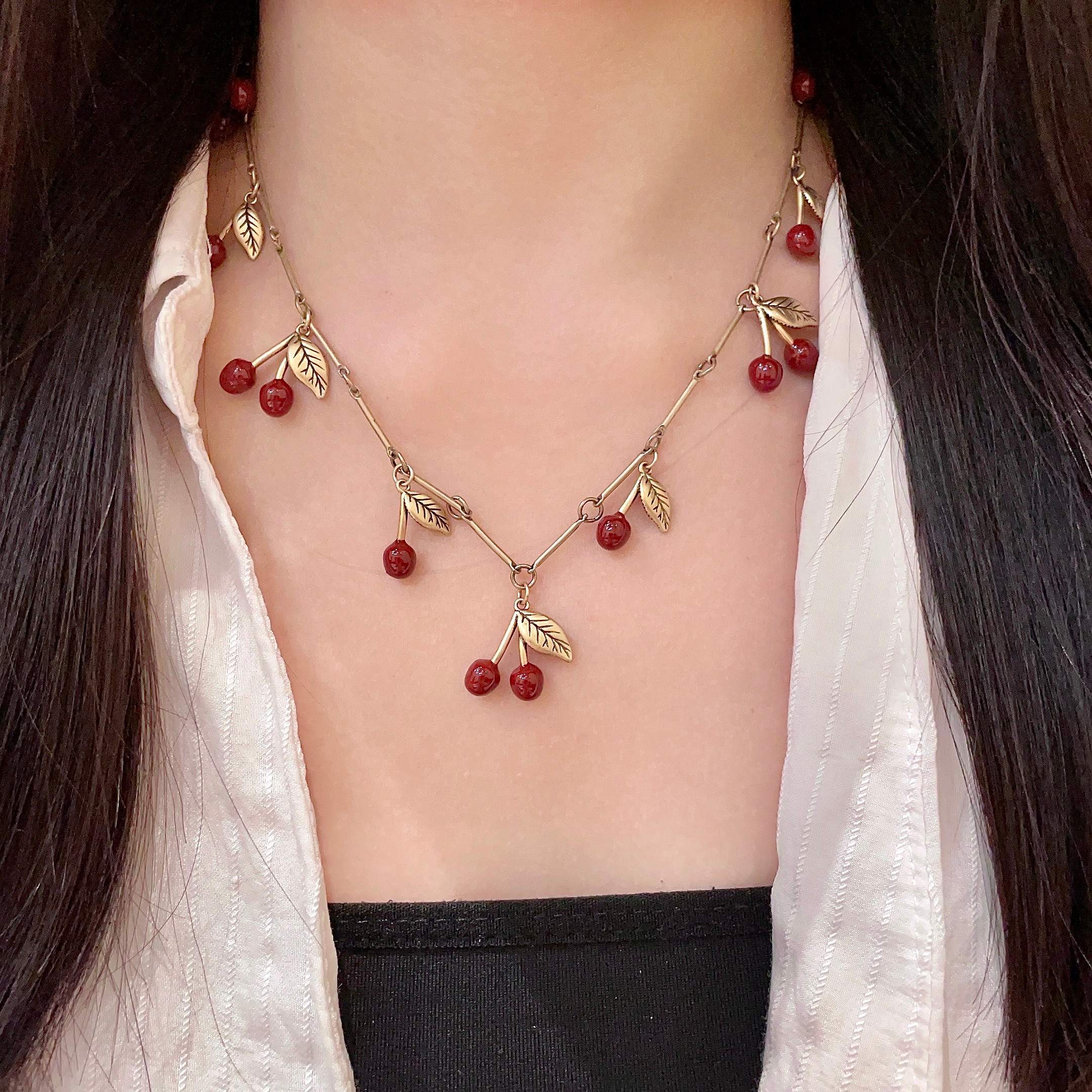 Saint Laurent 1961 Cherry Charm necklace antique gold metal deep red enamel cherry charms 42cm
