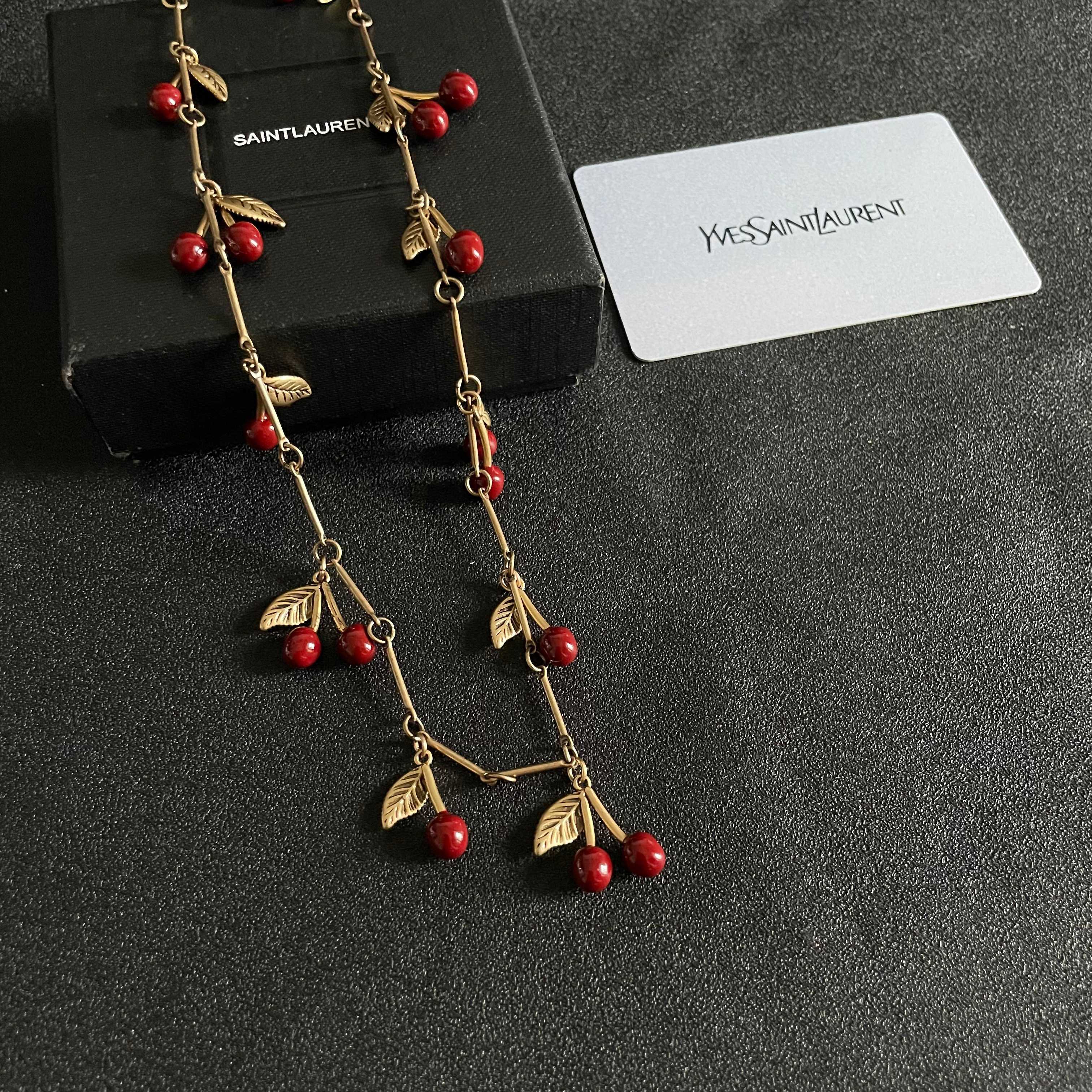 Saint Laurent Cherry Charm necklace antique gold tone metal deep red enamel cherry accents 42cm with 5cm extender
