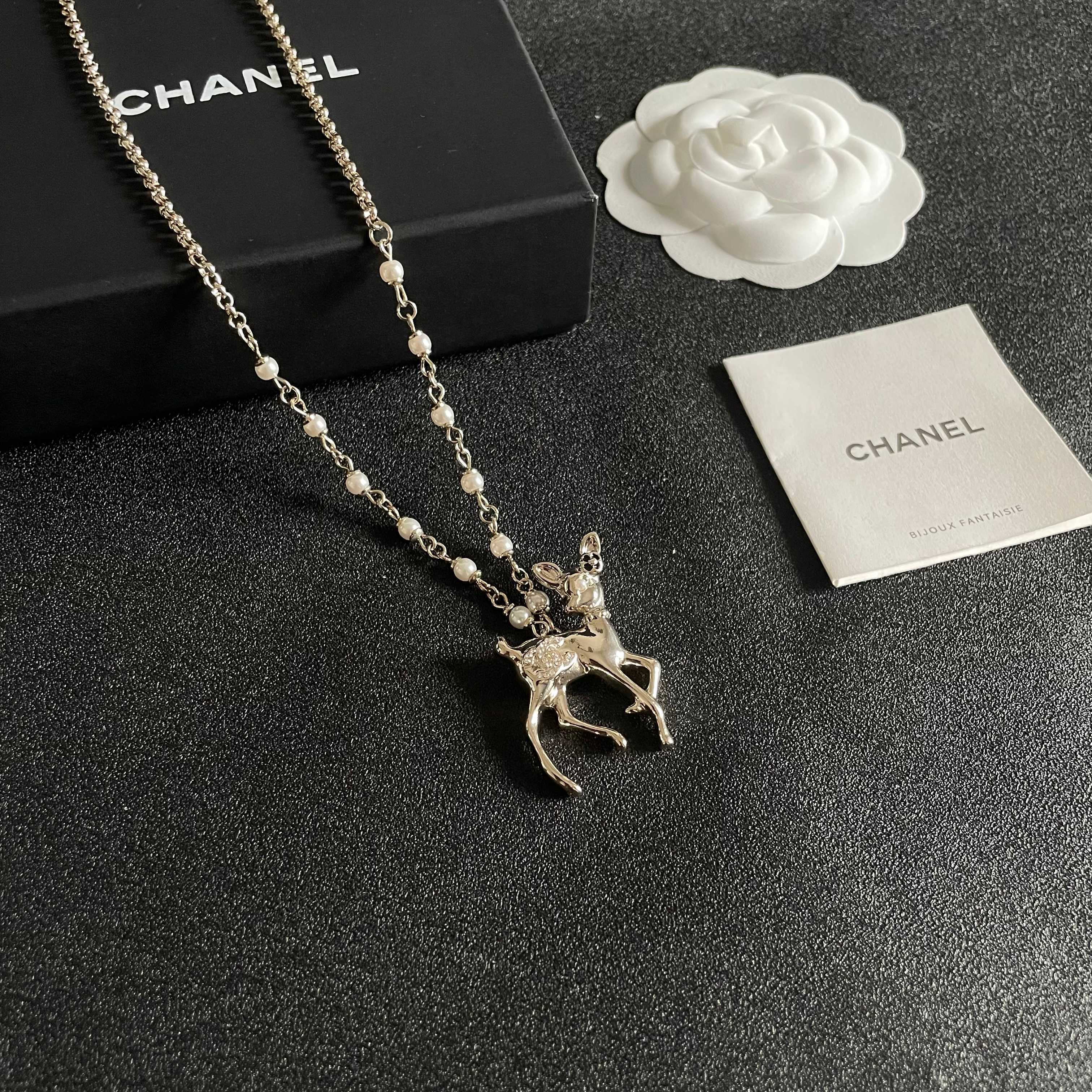 Chanel CC Logo Bambi Deer Pearl Pendant necklace Light gold-tone metal white faux pearls clear crystals black enamel accents 42cm