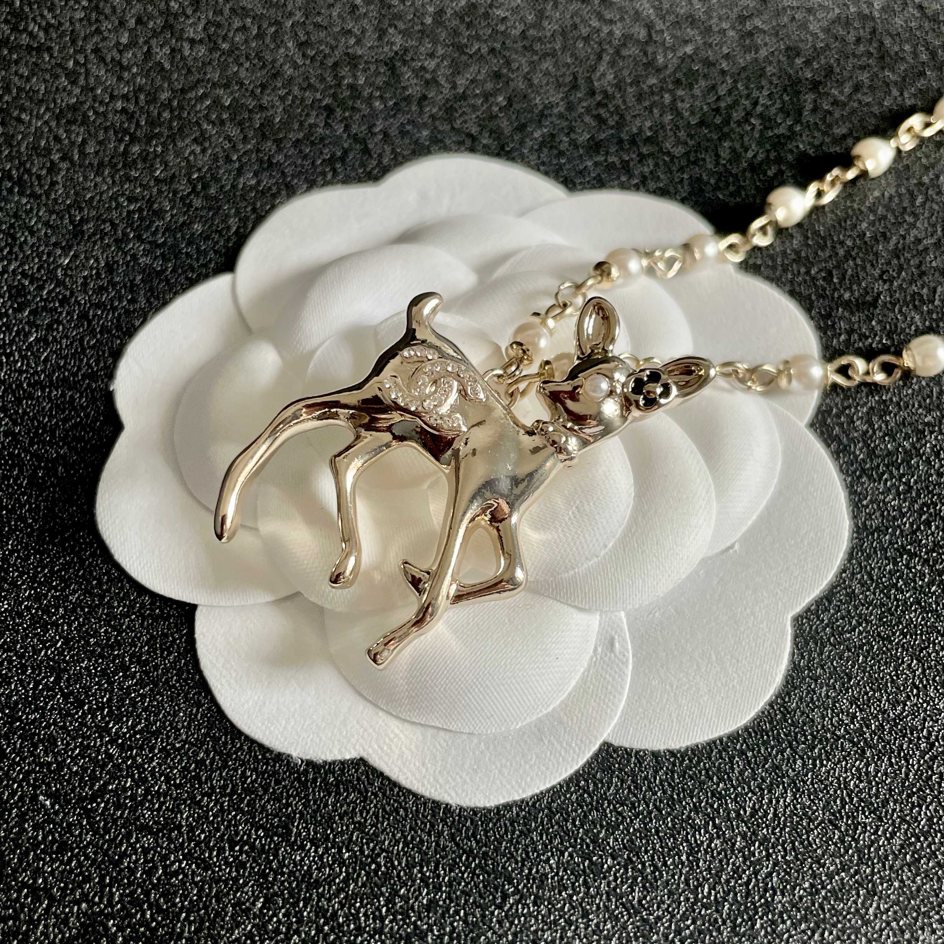 Chanel CC Logo Bambi Deer Pearl Pendant necklace Light gold-tone metal white faux pearls clear crystals black enamel accents 42cm