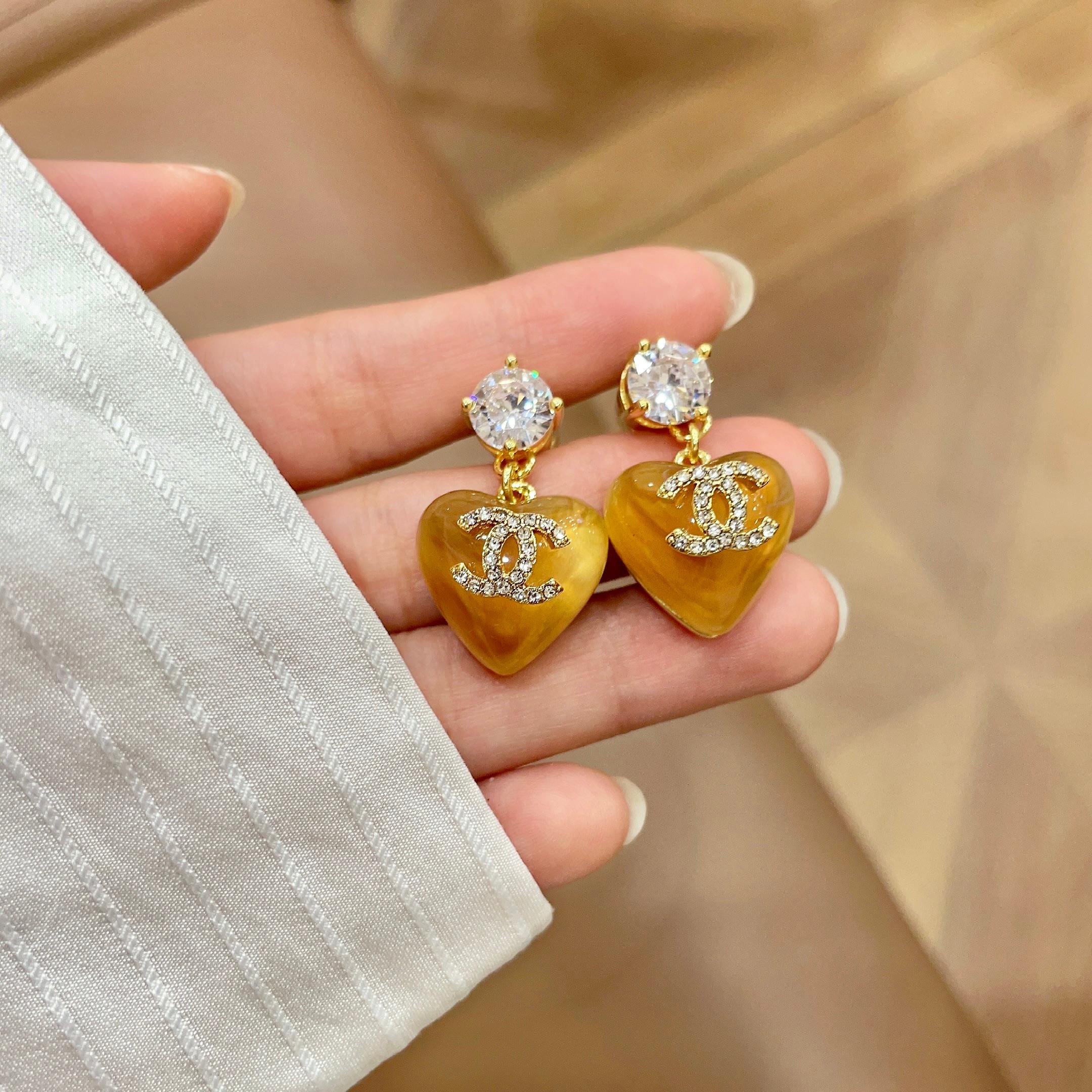 Chanel CC Logo Resin Heart Drop Earrings earrings gold tone metal orange translucent resin clear crystal accents 2 5cm drop length