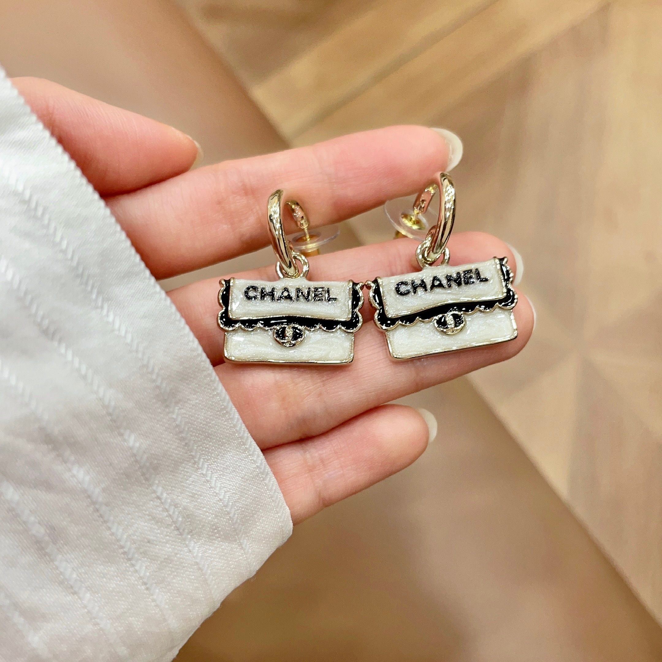 Chanel CC Logo Handbag Charm Drop Earrings earrings Light gold tone metal pearlescent white enamel black enamel lettering 1 5cm drop length