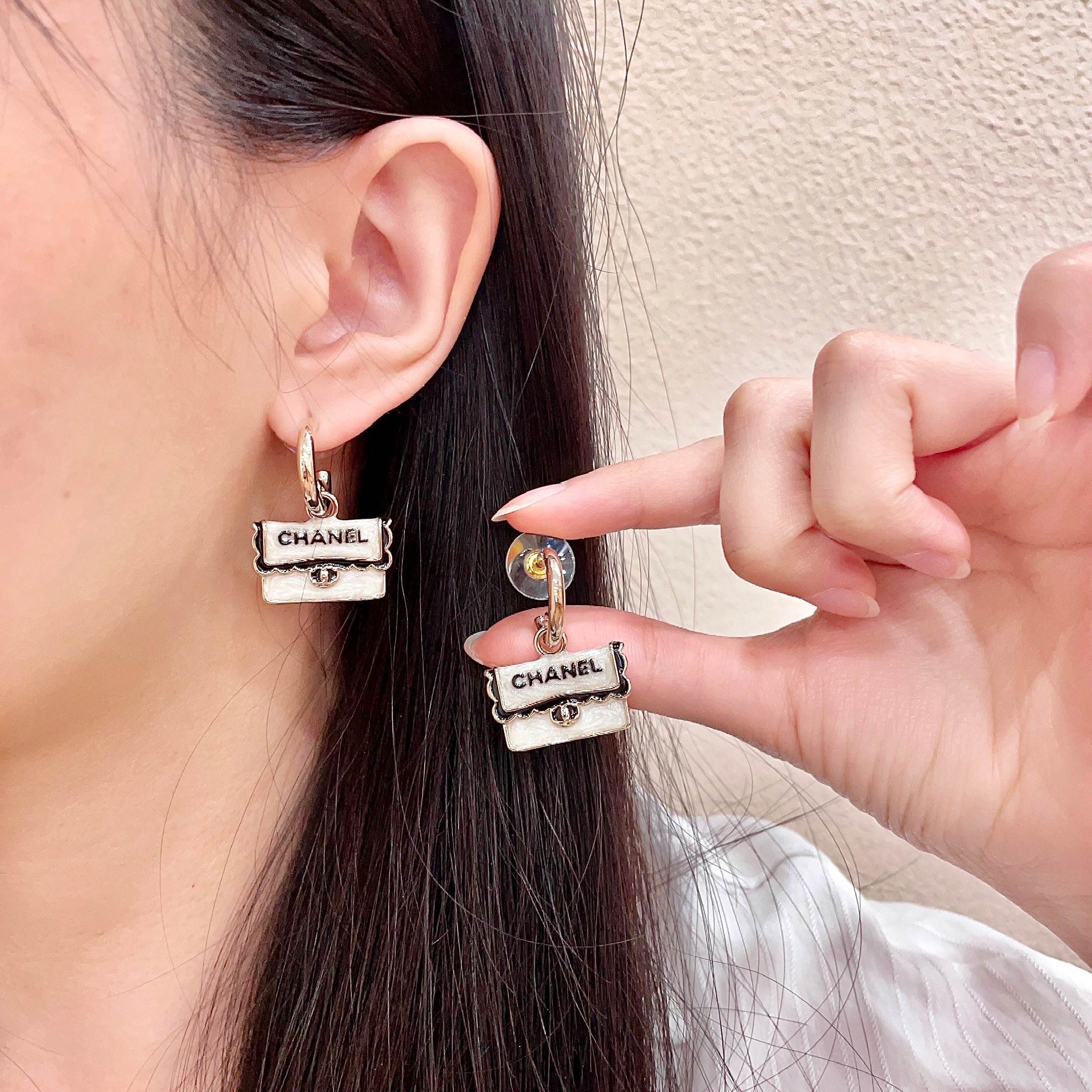 Chanel CC Logo Handbag Charm Drop Earrings earrings Light gold tone metal pearlescent white enamel black enamel lettering 1 5cm drop length