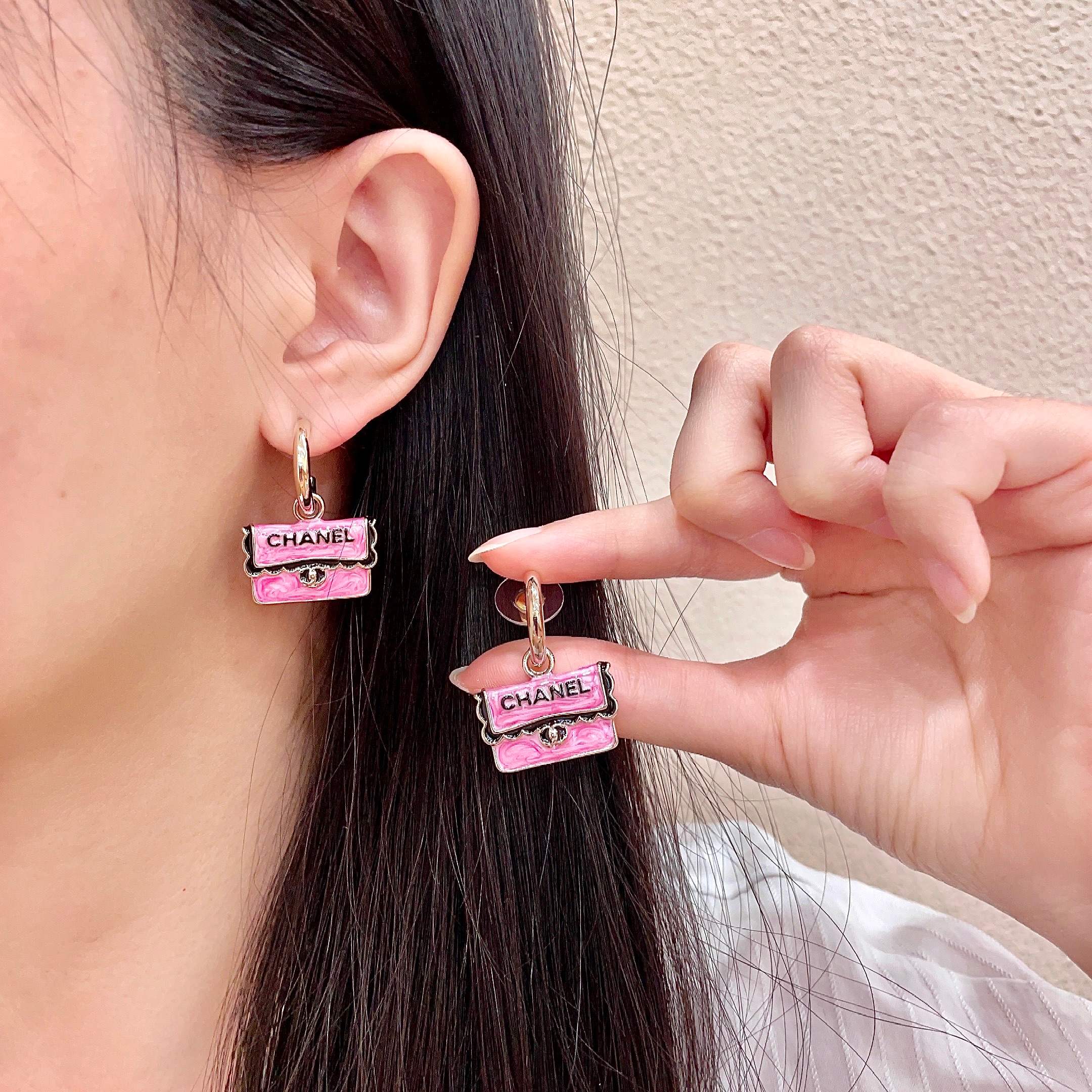 Chanel CC Logo Handbag Charm Drop Earrings earrings Gold-tone metal with pink enamel black enamel lettering and trim silver-tone turnlock detail 1 5cm hoop diameter 2cm total drop length
