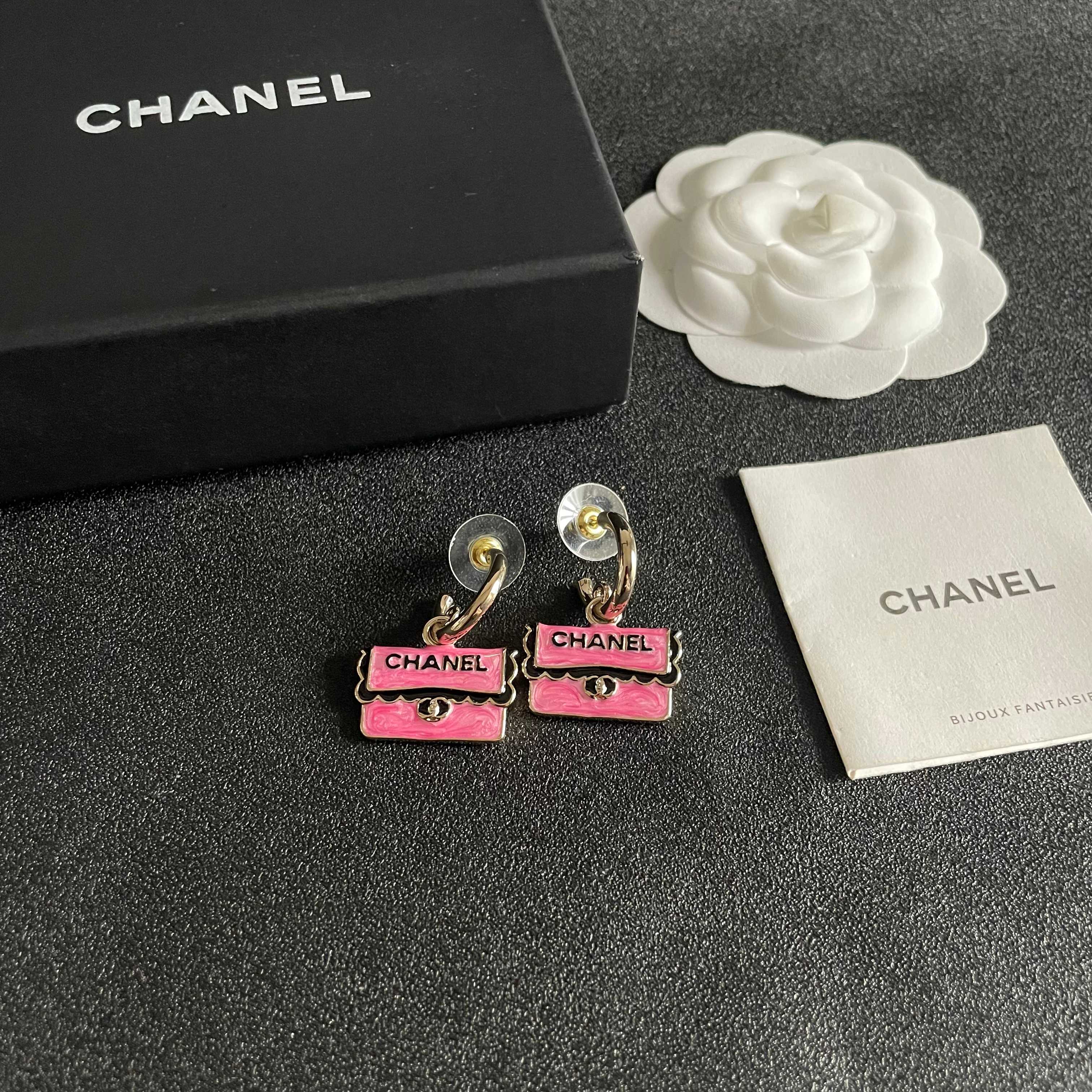Chanel CC Logo Handbag Charm Drop Earrings earrings Gold-tone metal with pink enamel black enamel lettering and trim silver-tone turnlock detail 1 5cm hoop diameter 2cm total drop length