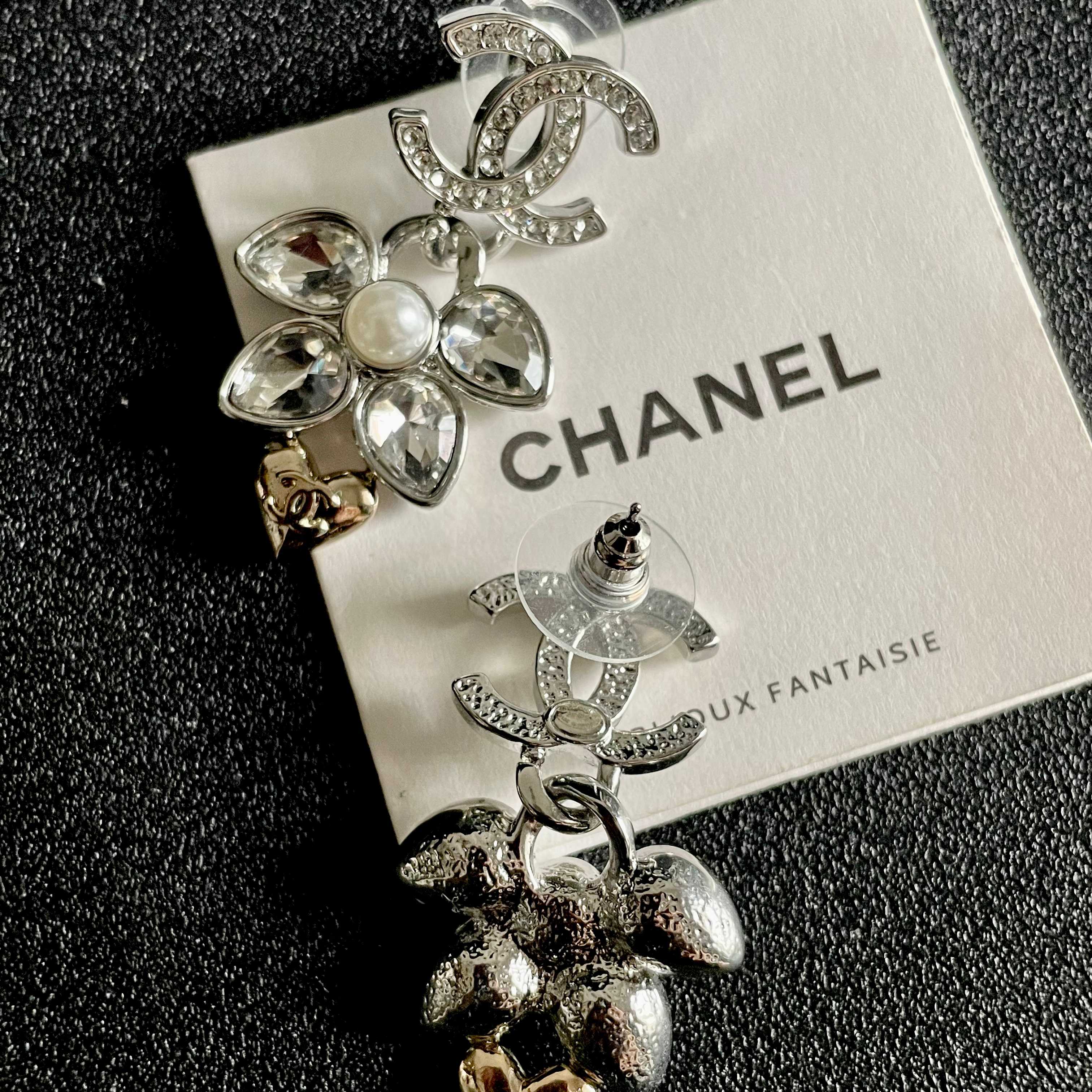Chanel CC Logo Flower Heart Drop Earrings earrings Silver-tone metal with clear crystals white faux pearl and gold-tone heart accent Approximately 3cm drop length