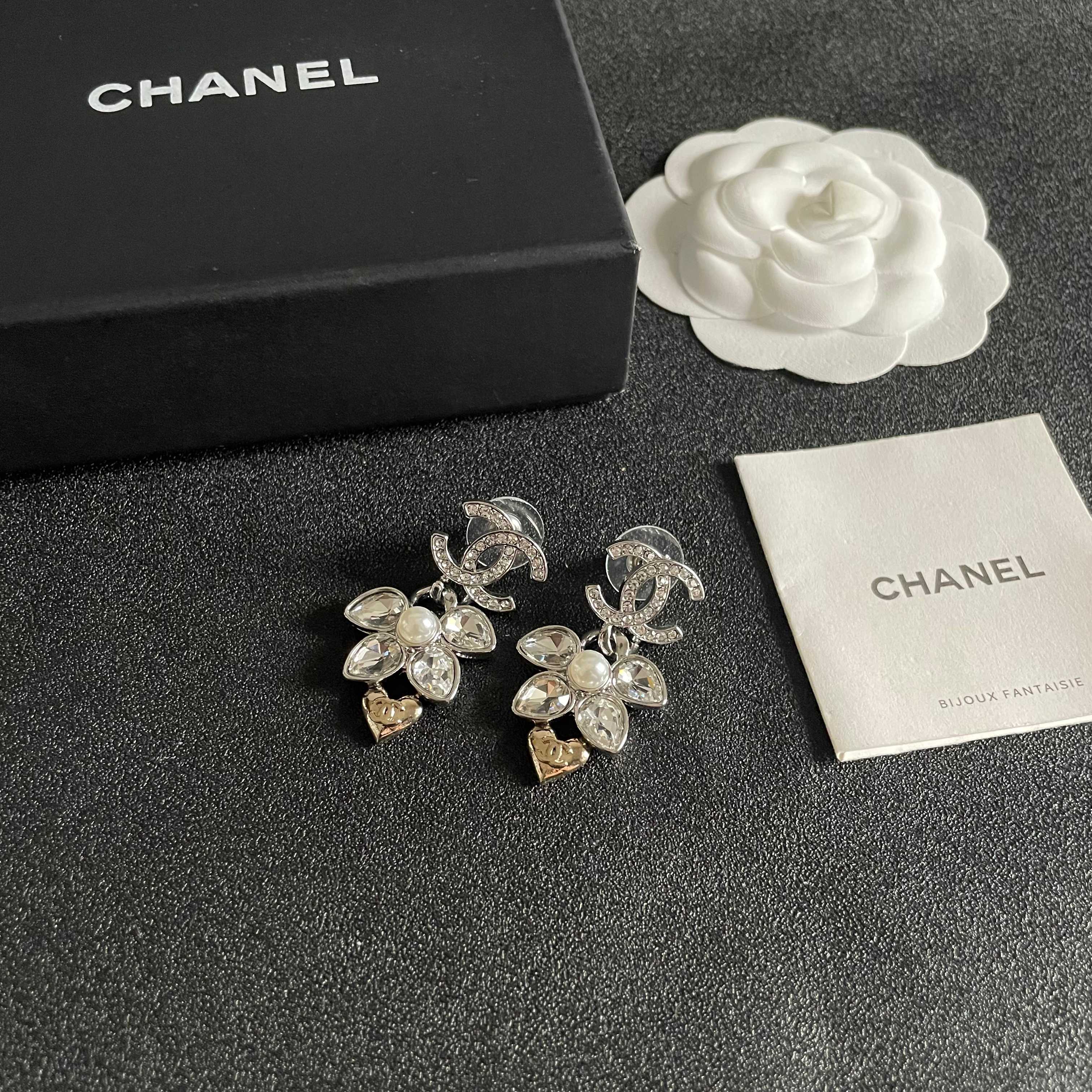 Chanel CC Logo Flower Heart Drop Earrings earrings Silver-tone metal with clear crystals white faux pearl and gold-tone heart accent Approximately 3cm drop length