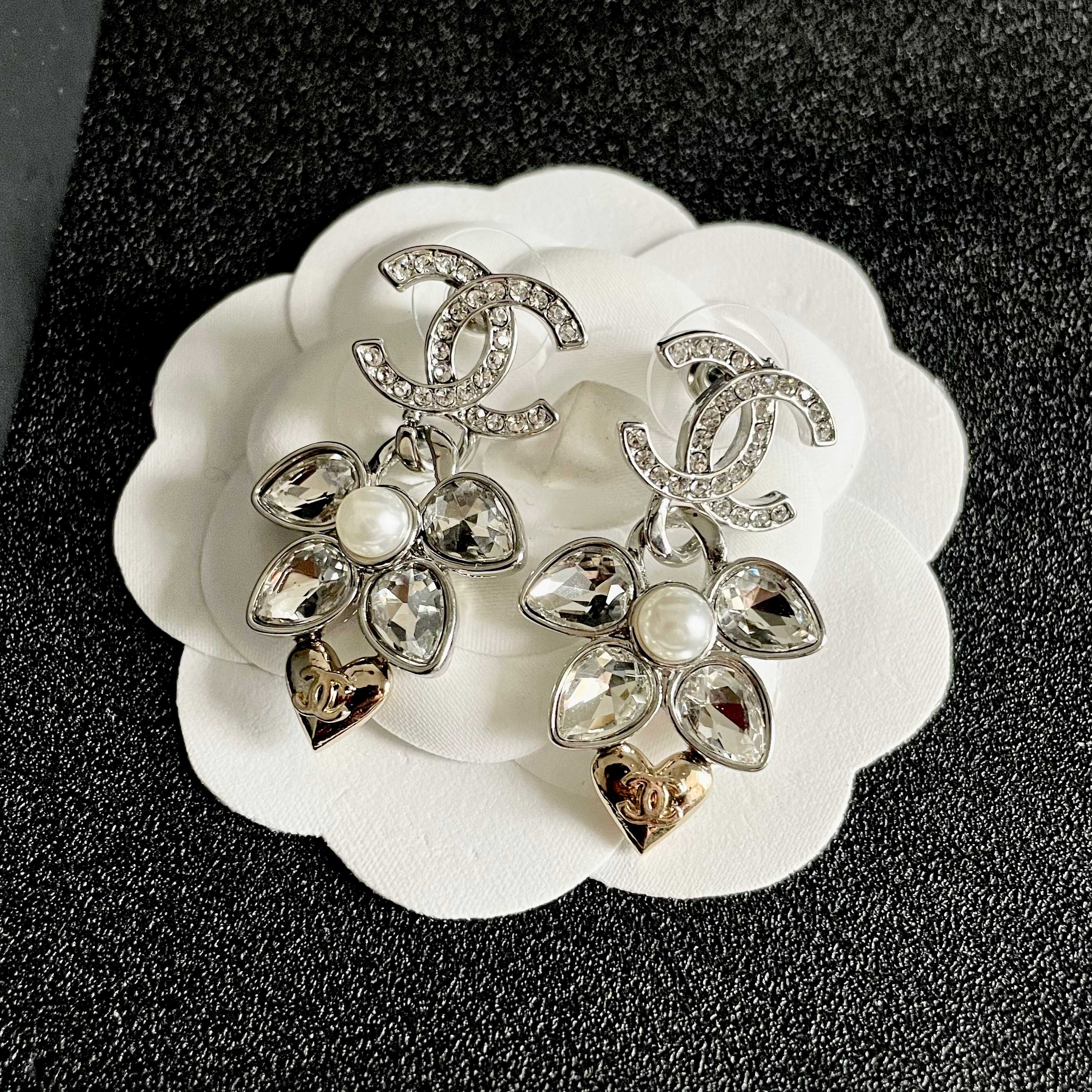 Chanel CC Logo Flower Heart Drop Earrings earrings Silver-tone metal with clear crystals white faux pearl and gold-tone heart accent Approximately 3cm drop length