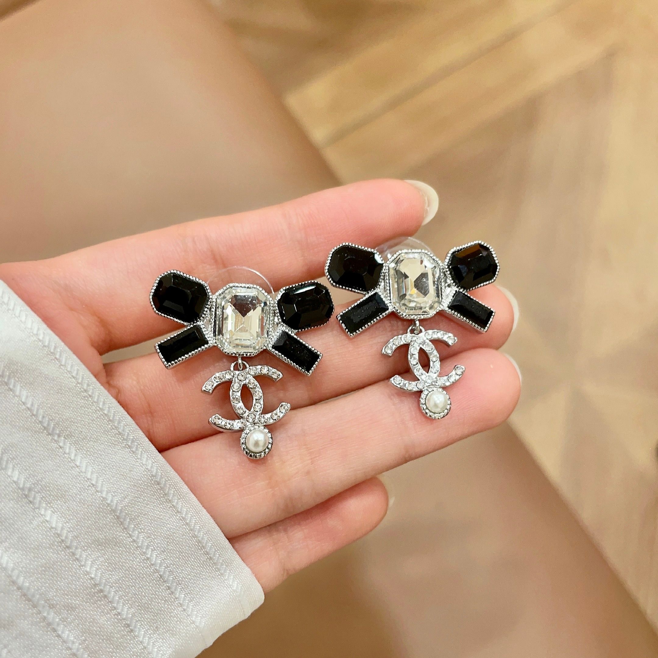 Chanel CC Logo Bow Drop Earrings earrings Silver-tone metal with black resin clear crystal and white pearl accents One Size 2 5cm drop length