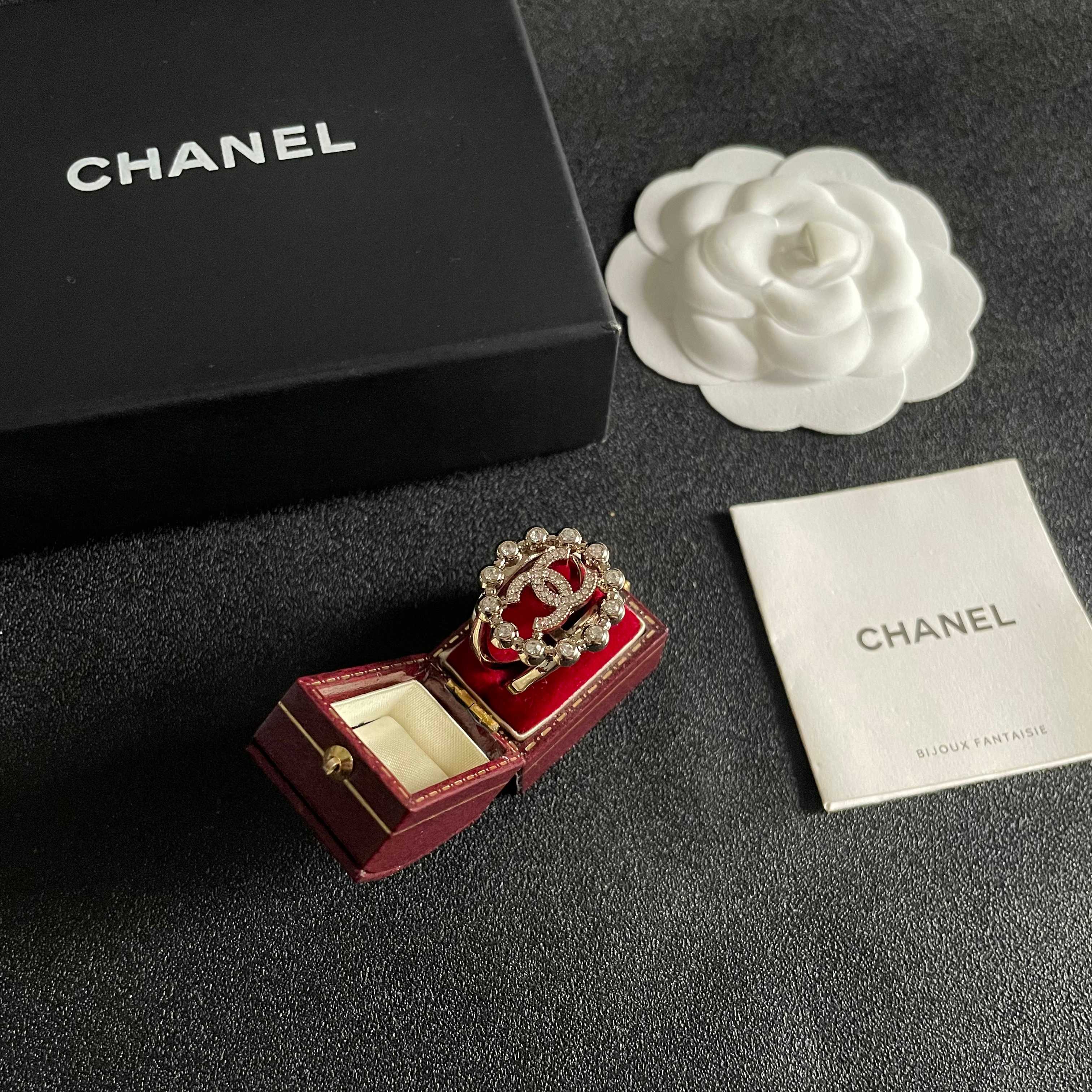Chanel CC Logo Crystal Embellished Open Ring ring Light gold-tone metal with clear crystal accents Adjustable open band US size 7 equivalent