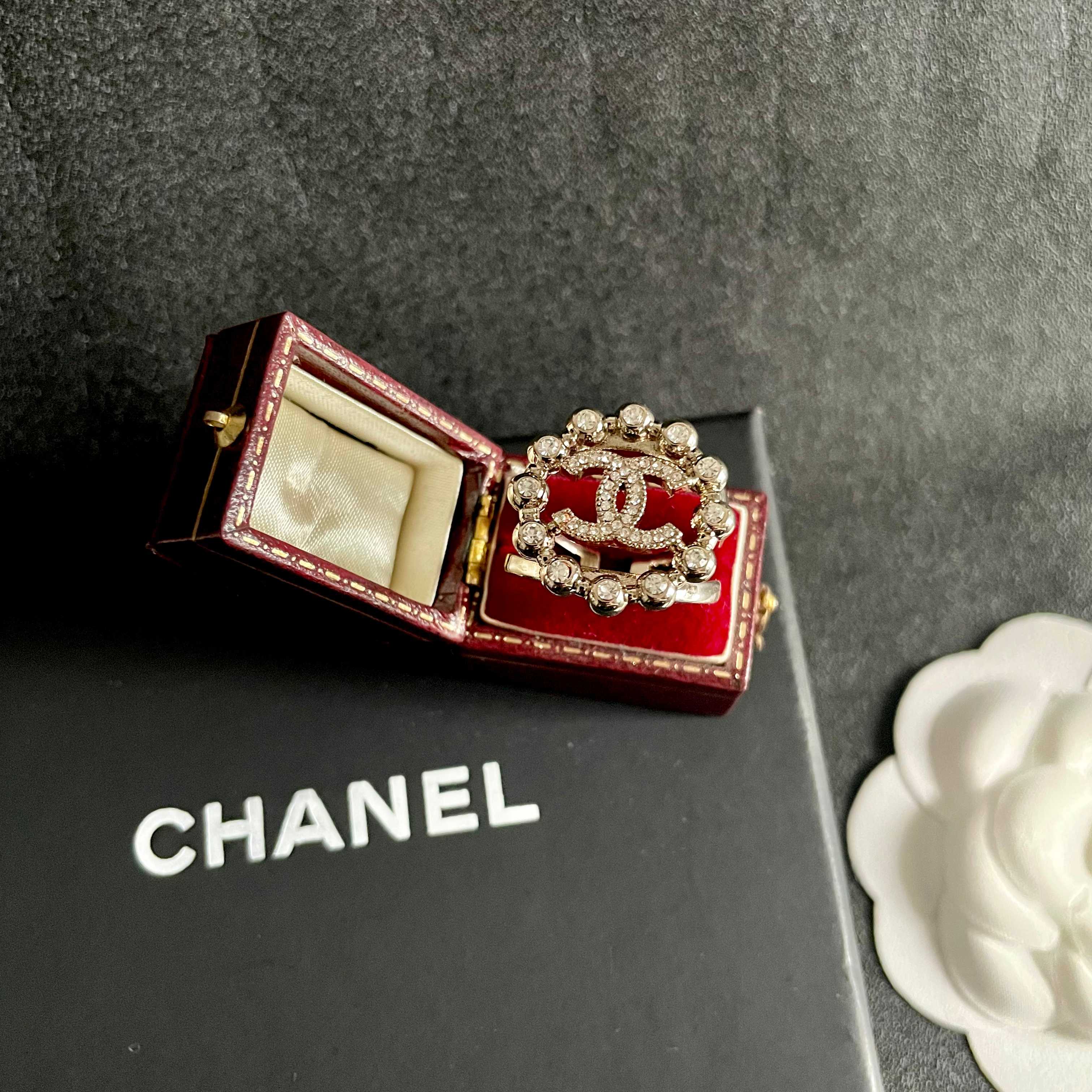 Chanel CC Logo Crystal Embellished Open Ring ring Light gold-tone metal with clear crystal accents Adjustable open band US size 7 equivalent
