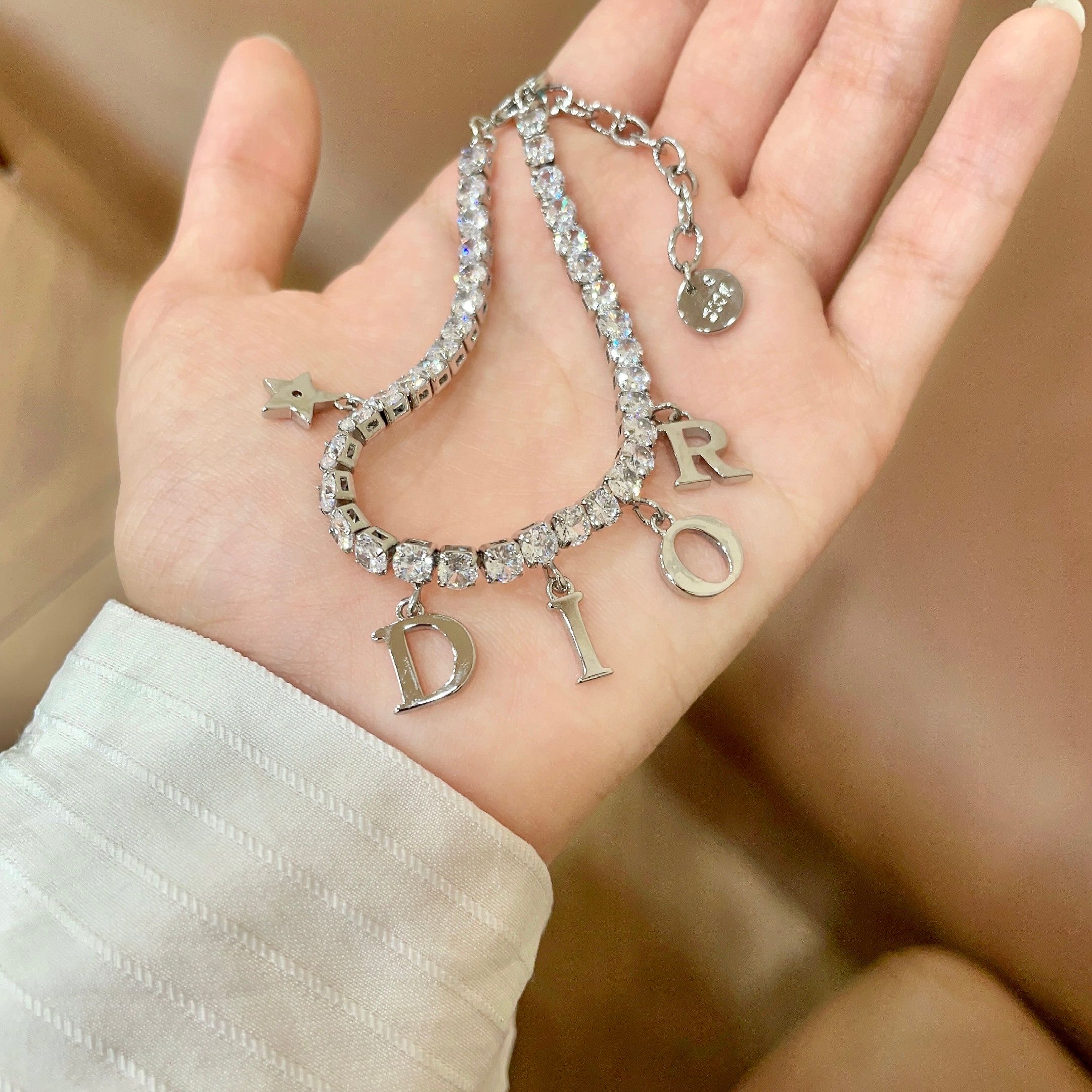 Dior Dio r evolution Crystal Letter Charm bracelet silver-toned metal with clear faceted crystals 16cm with 3cm extender