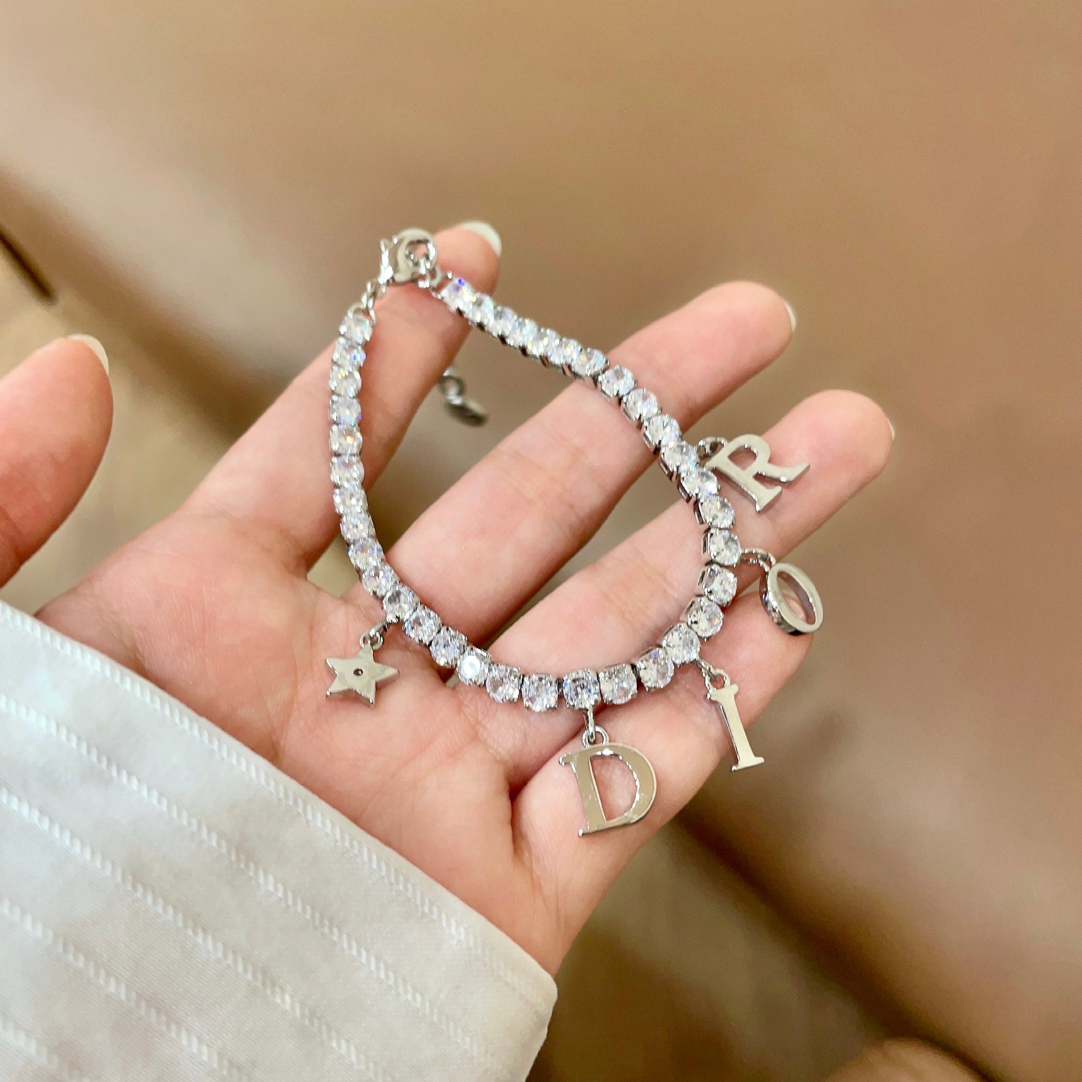 Dior Dio r evolution Crystal Letter Charm bracelet silver-toned metal with clear faceted crystals 16cm with 3cm extender