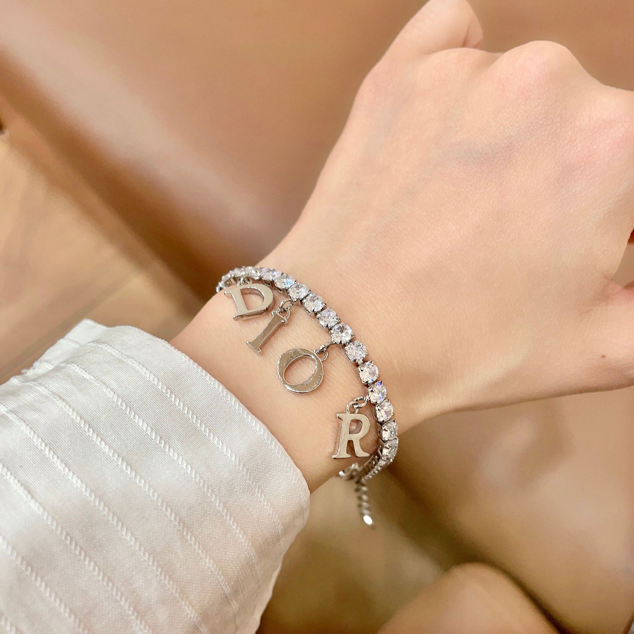 Dior Dio r evolution Crystal Letter Charm bracelet silver-toned metal with clear faceted crystals 16cm with 3cm extender
