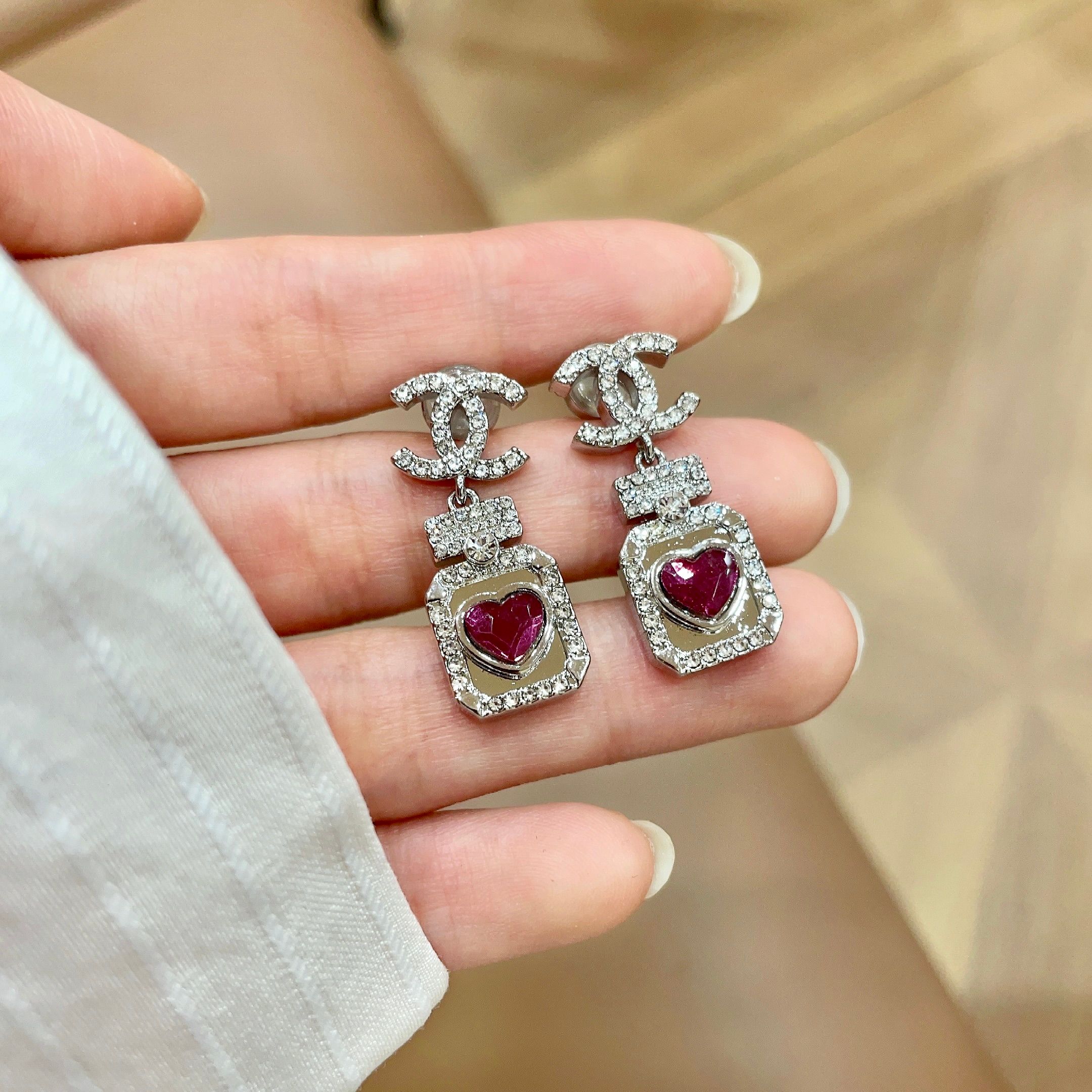 Chanel CC Logo Perfume Bottle Heart Drop Earrings earrings silver-toned metal with clear crystals and fuchsia heart-shaped stone 2 5cm drop length