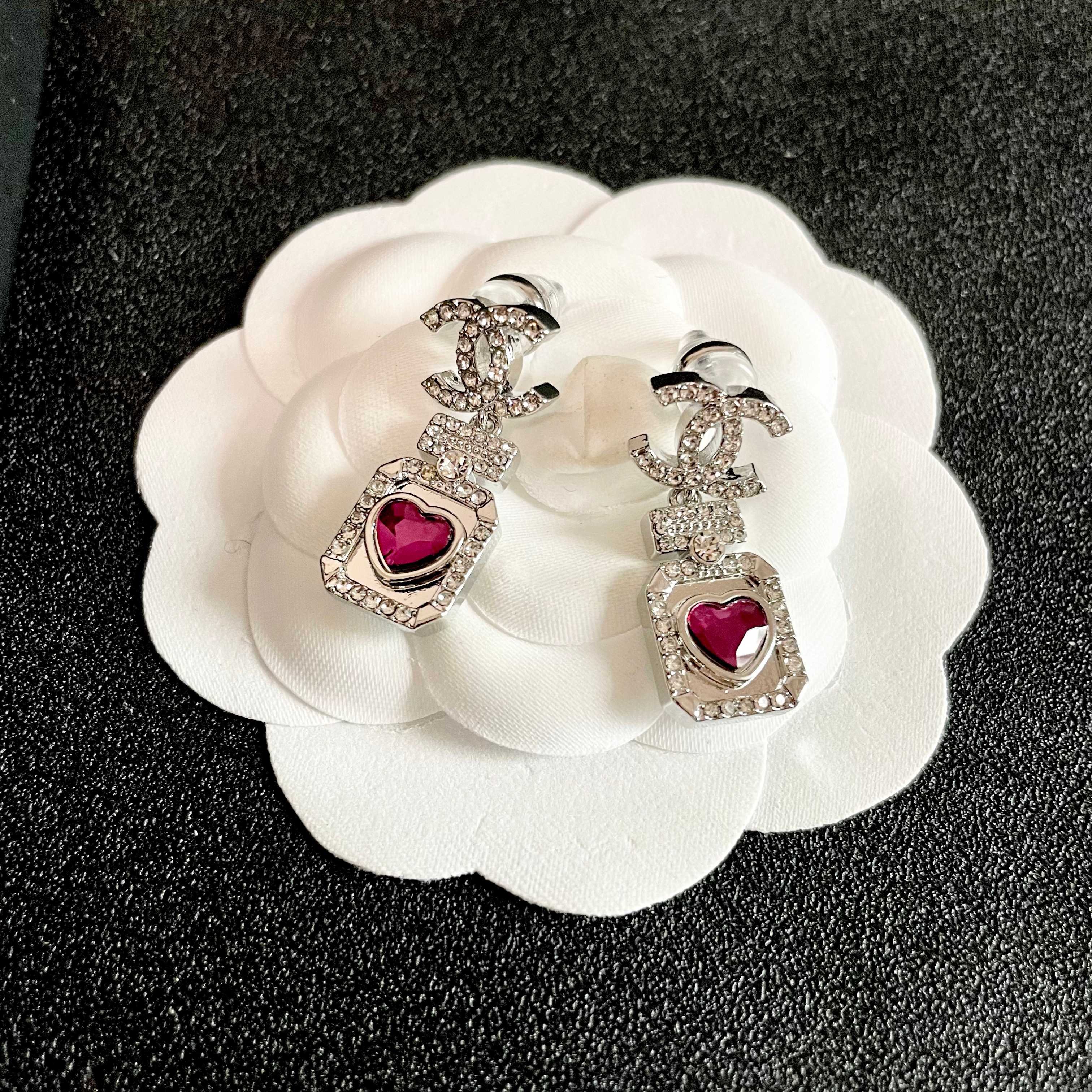 Chanel CC Logo Perfume Bottle Heart Drop Earrings earrings silver-toned metal with clear crystals and fuchsia heart-shaped stone 2 5cm drop length