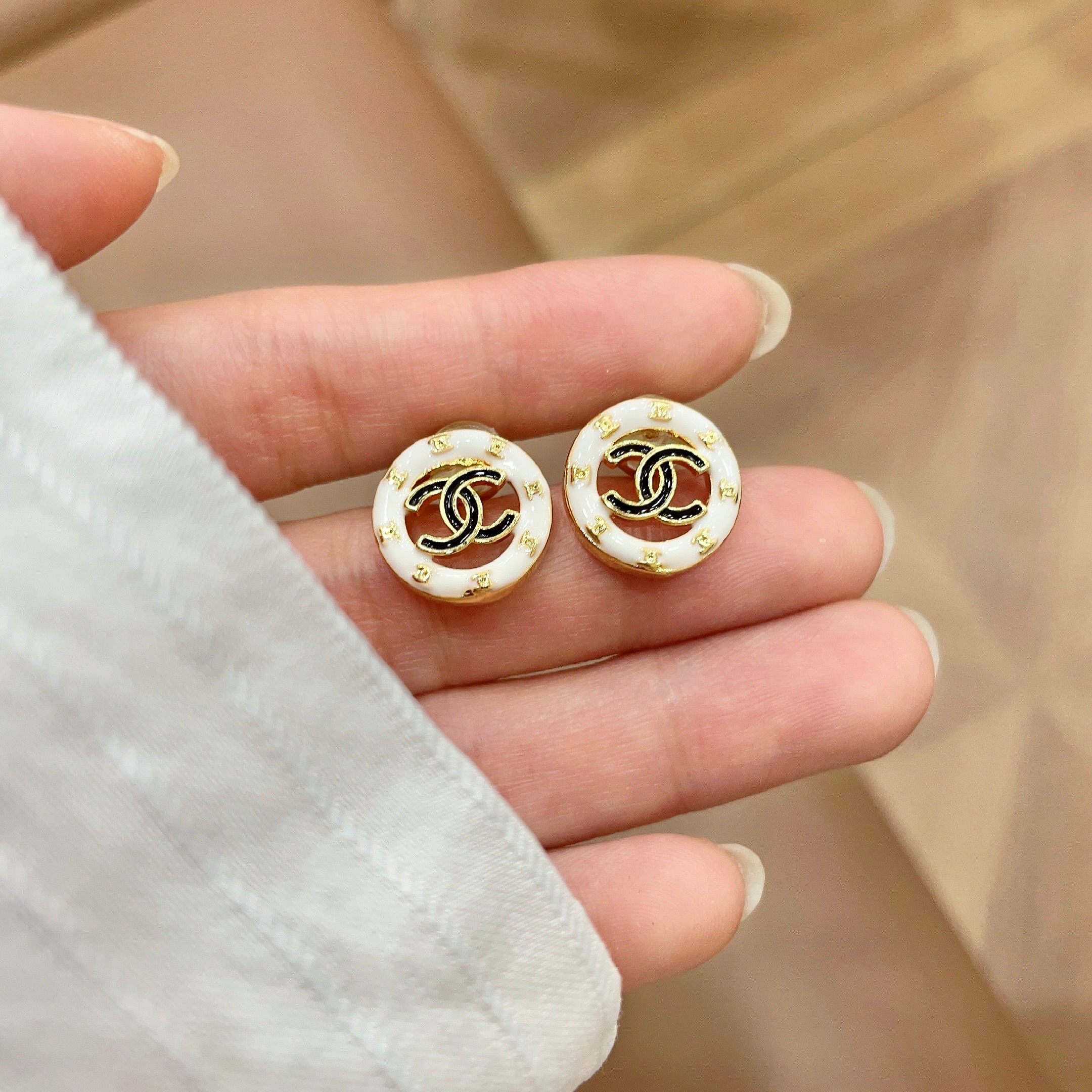 Chanel CC Logo Round Stud Earrings earrings Gold-tone metal white enamel black CC logo 1 2cm diameter