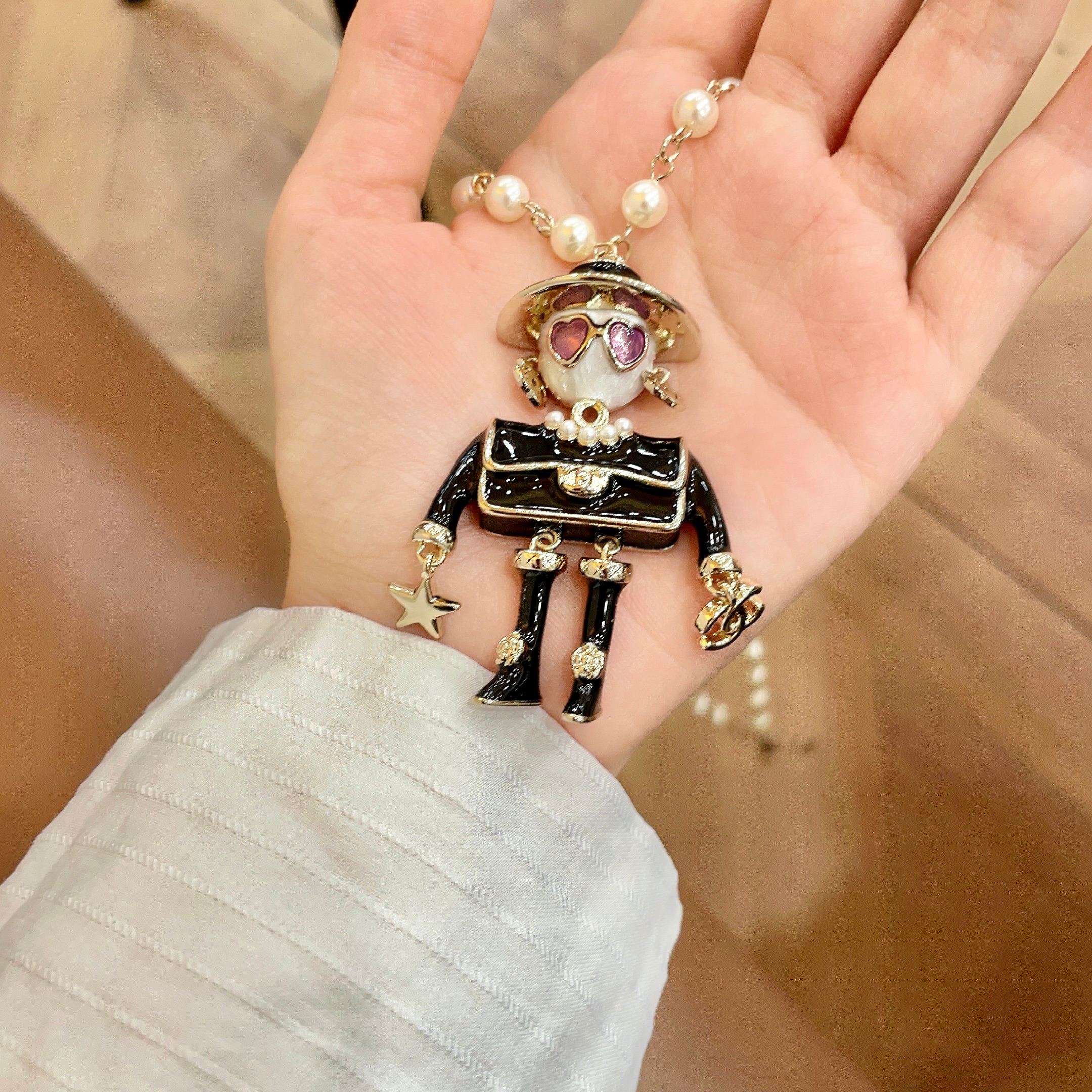 Chanel Coco Doll Pendant Necklace necklace Light gold tone metal cream faux pearls black enamel pink enamel accents 42cm with 5cm extender chain