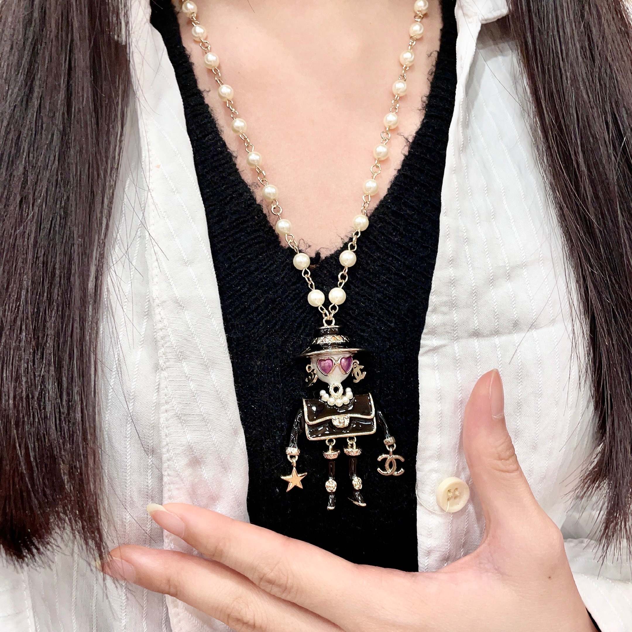Chanel Coco Doll Pendant Necklace necklace Light gold tone metal cream faux pearls black enamel pink enamel accents 42cm with 5cm extender chain