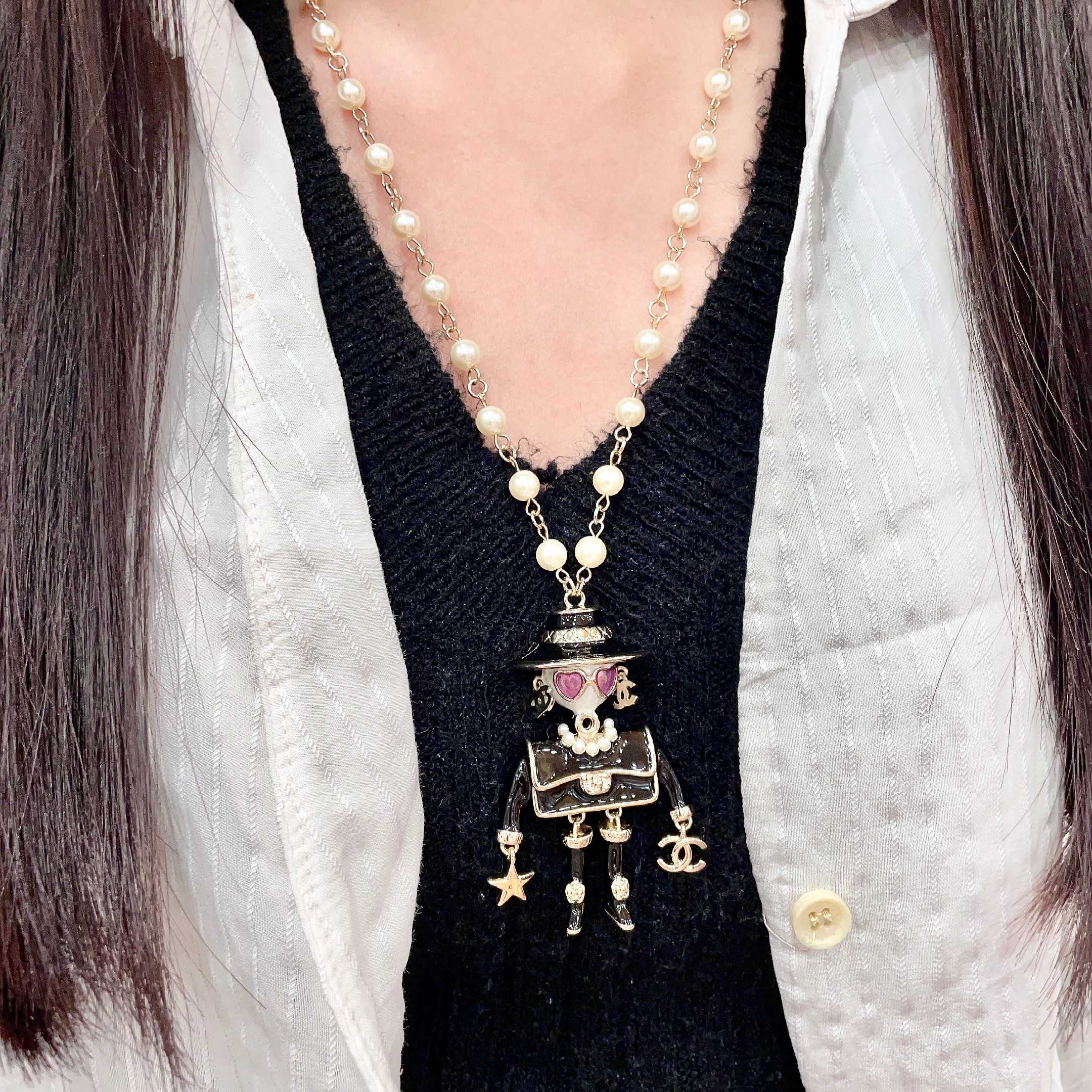 Chanel Coco Doll Pendant Necklace necklace Light gold tone metal cream faux pearls black enamel pink enamel accents 42cm with 5cm extender chain