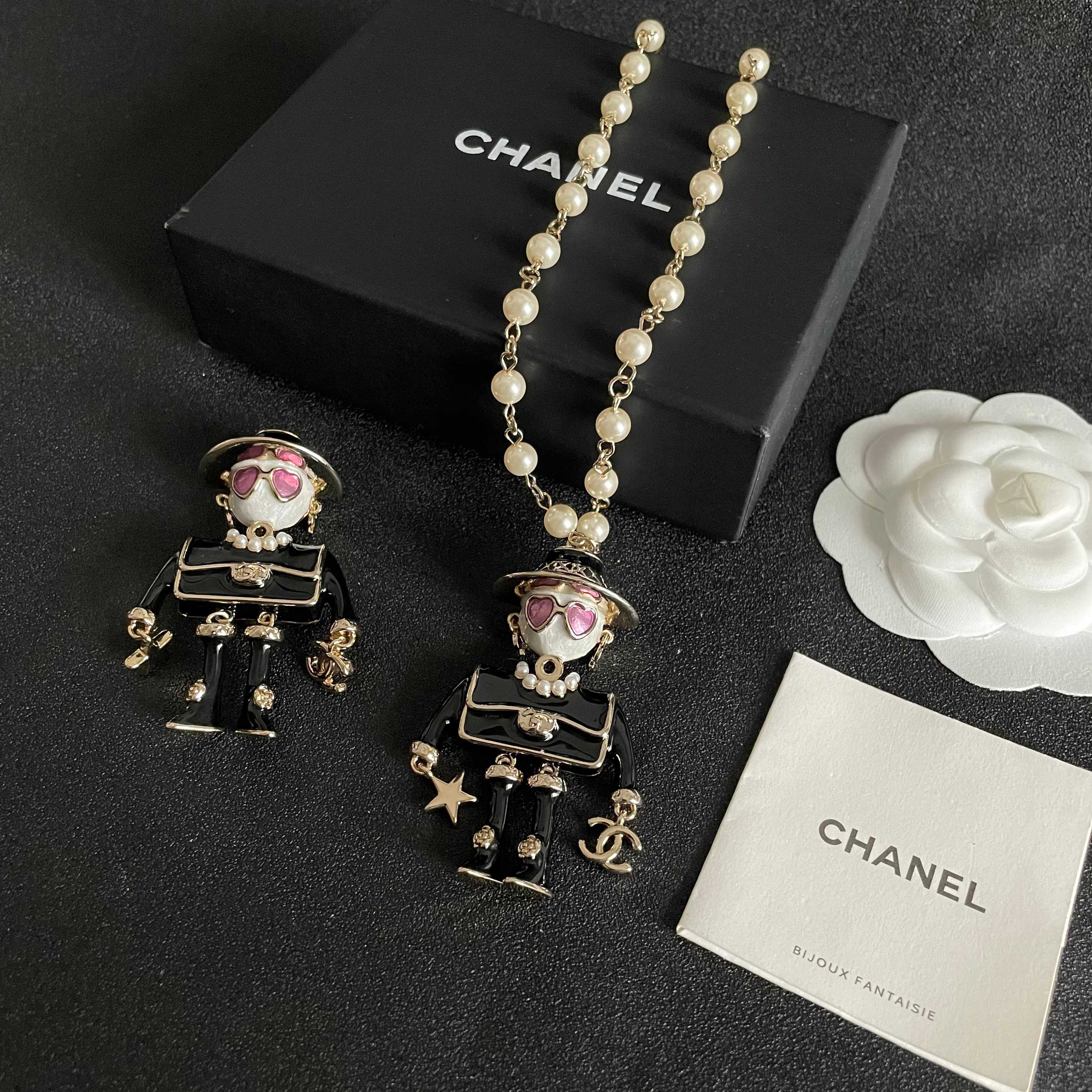 Chanel Coco Doll Pendant Necklace necklace Light gold tone metal cream faux pearls black enamel pink enamel accents 42cm with 5cm extender chain