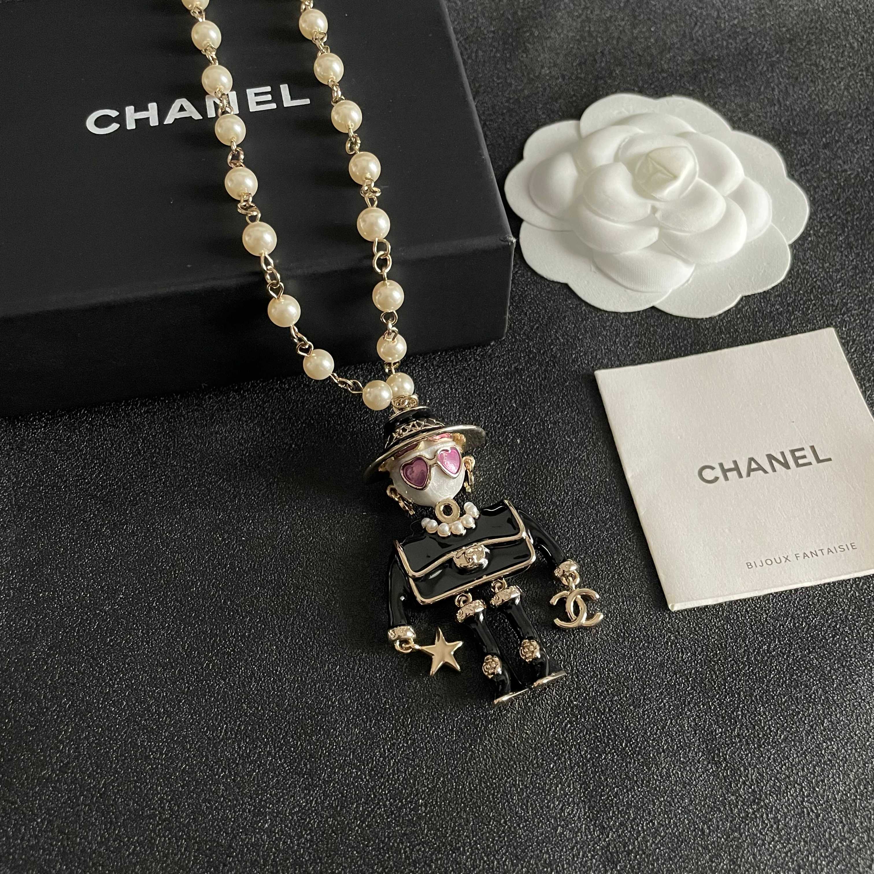 Chanel Coco Doll Pendant Necklace necklace Light gold tone metal cream faux pearls black enamel pink enamel accents 42cm with 5cm extender chain