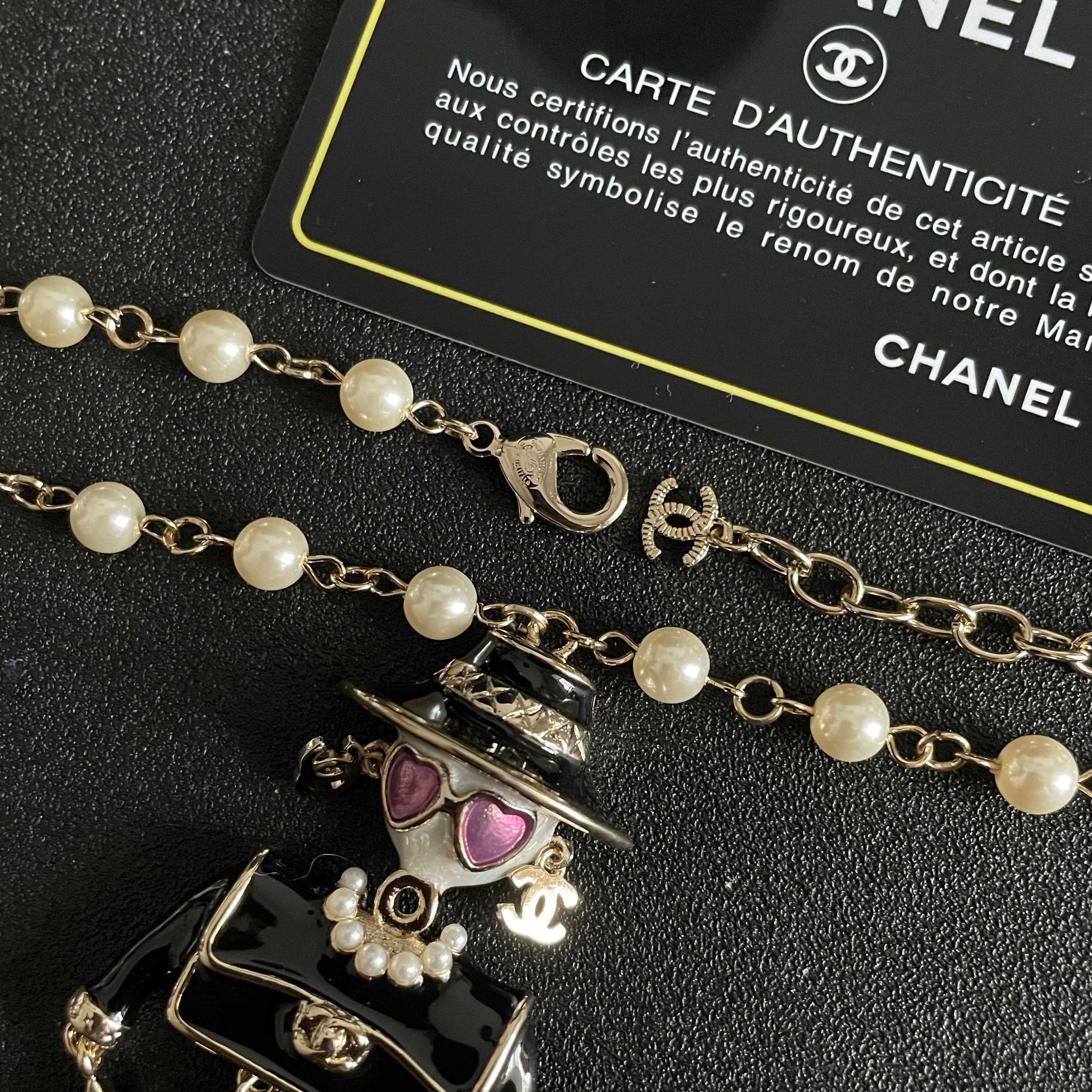 Chanel Coco Doll Pendant Necklace necklace Light gold tone metal cream faux pearls black enamel pink enamel accents 42cm with 5cm extender chain