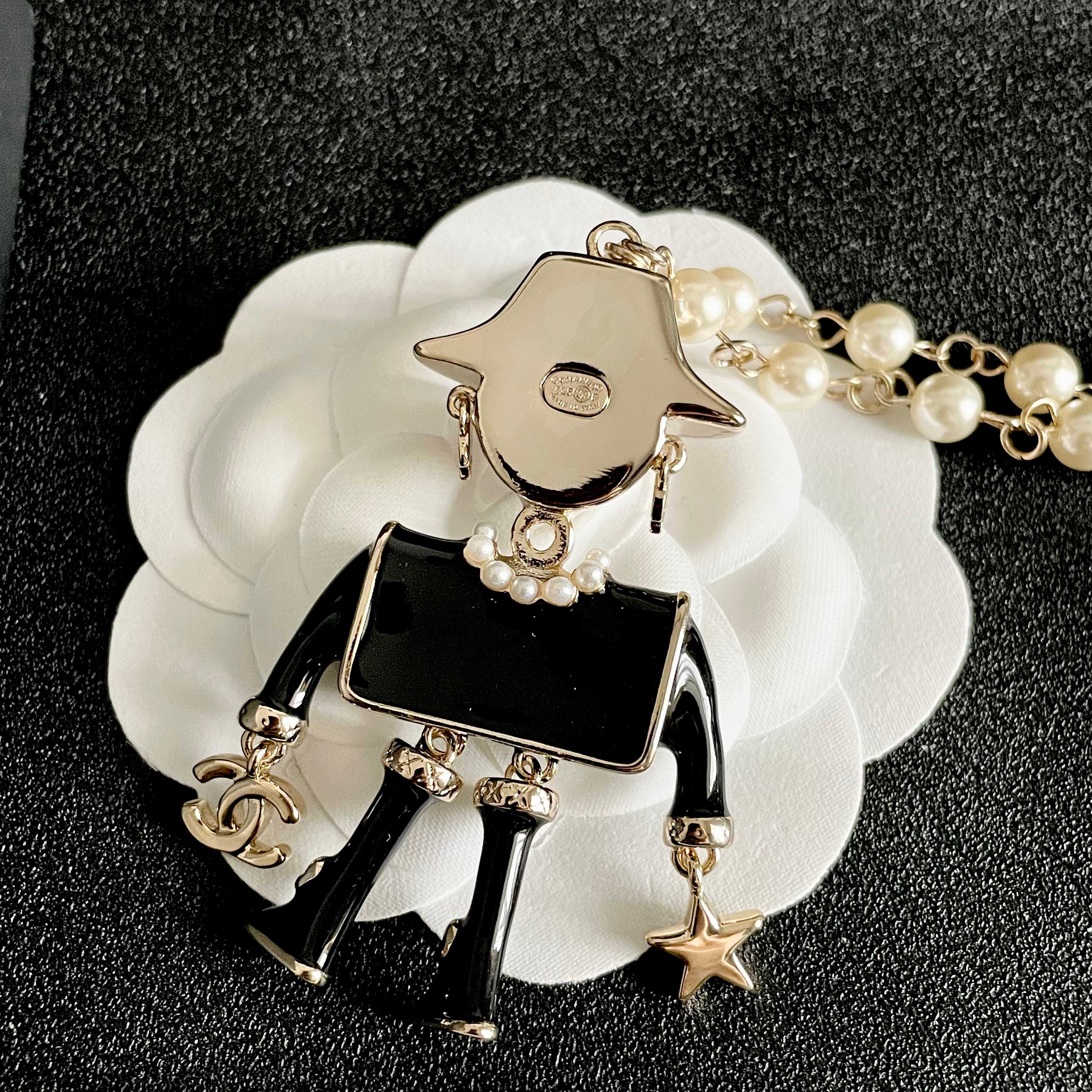 Chanel Coco Doll Pendant Necklace necklace Light gold tone metal cream faux pearls black enamel pink enamel accents 42cm with 5cm extender chain