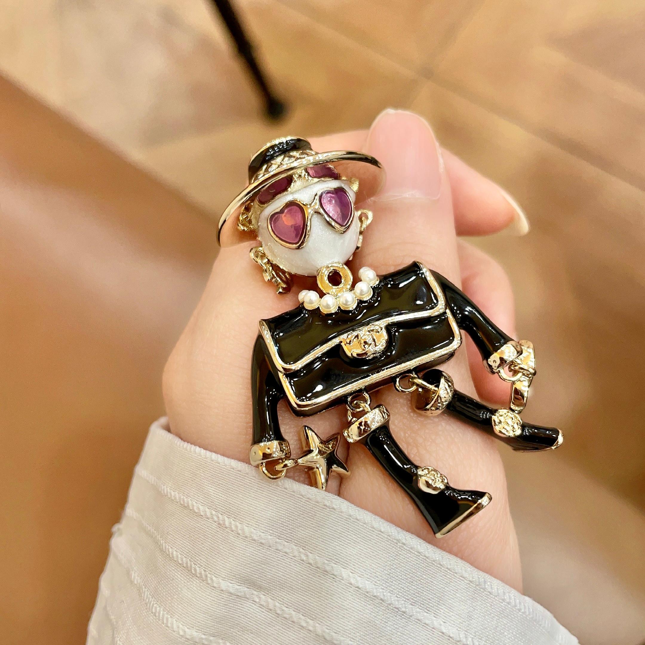Chanel CC Doll Character Brooch brooch Gold-tone metal with black enamel white faux pearl pink heart enamel white resin One Size