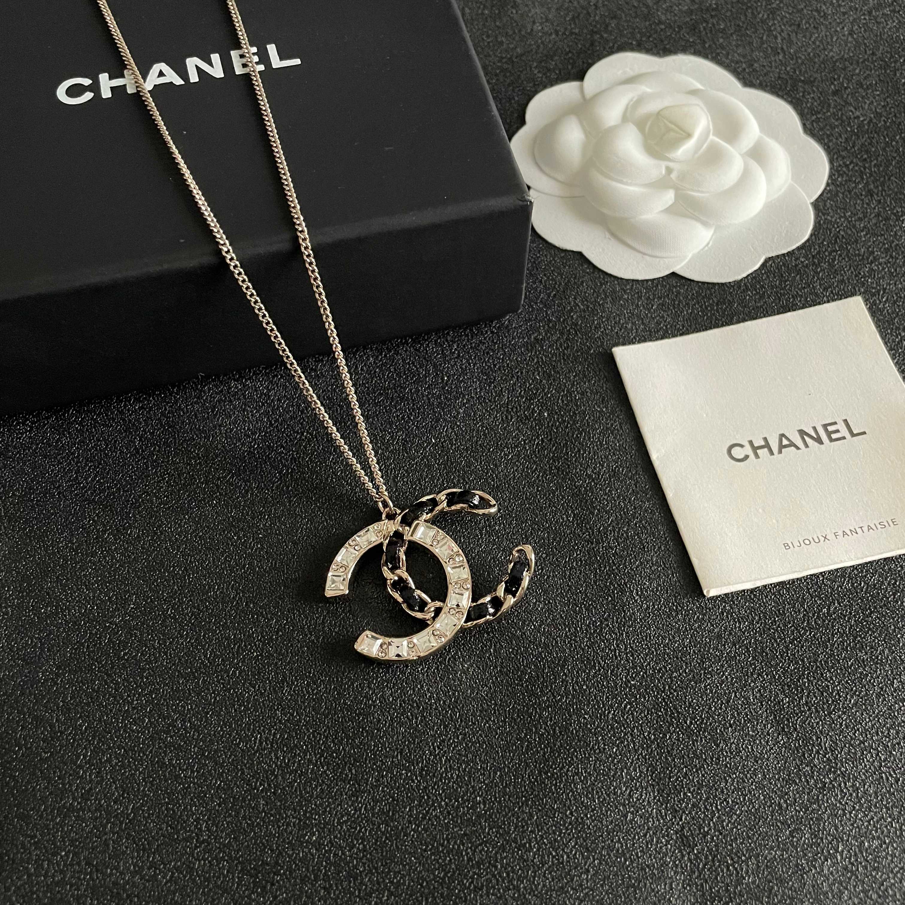 Chanel CC Logo Crystal Leather Woven Pendant Necklace necklace Gold-tone metal with clear faceted crystals and black woven leather accents 42cm
