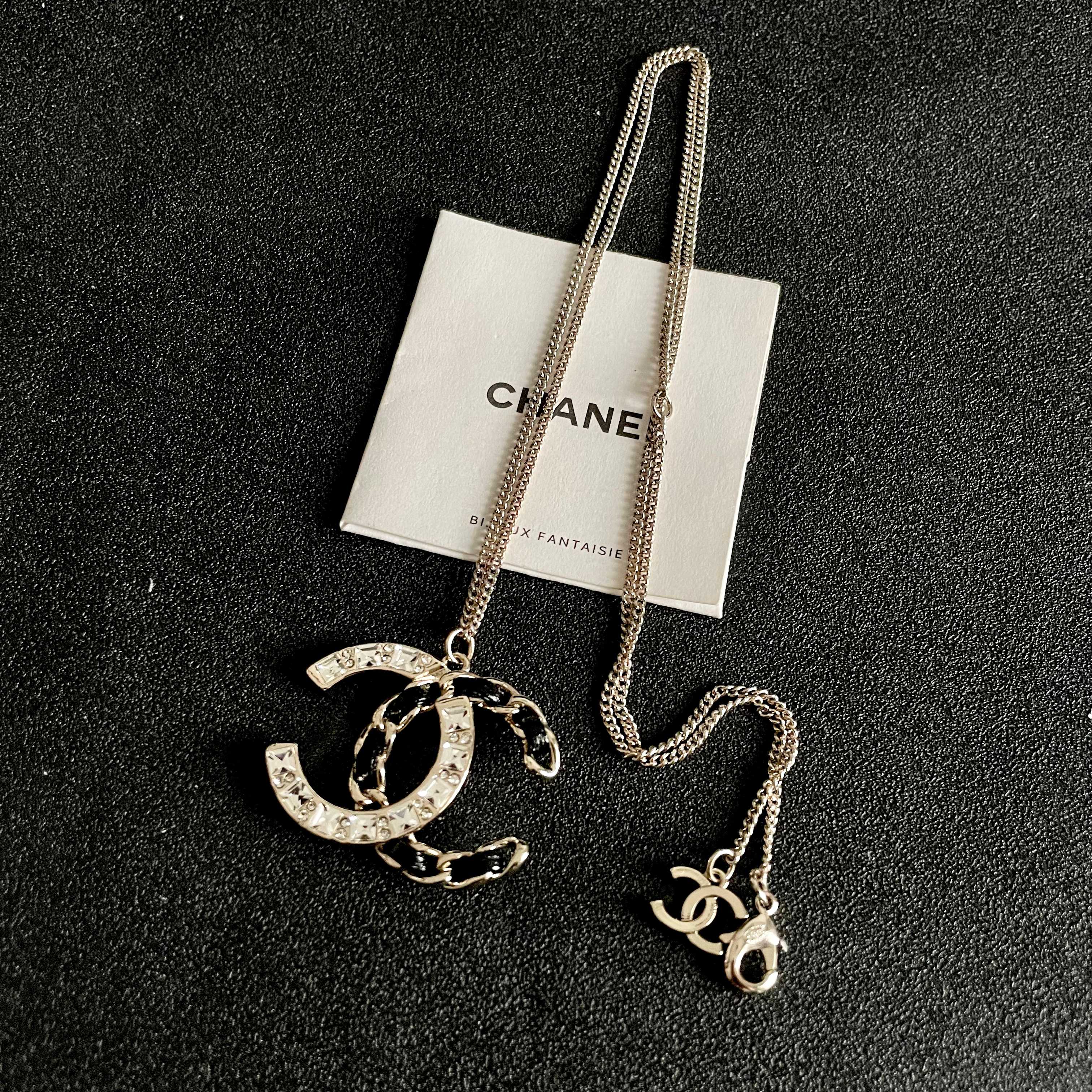 Chanel CC Logo Crystal Leather Woven Pendant Necklace necklace Gold-tone metal with clear faceted crystals and black woven leather accents 42cm