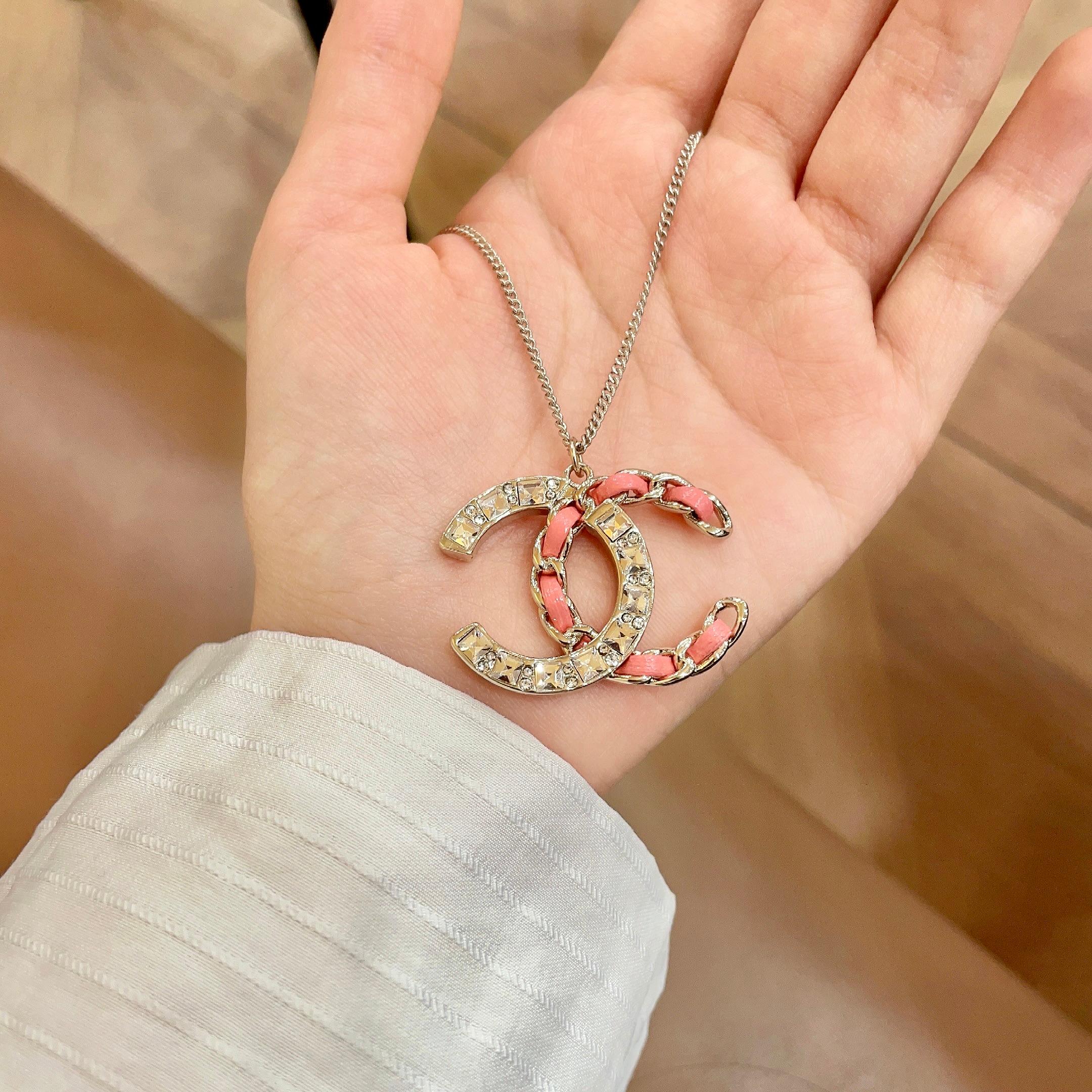 Chanel CC Logo Chain Woven Crystal Pendant Necklace necklace Light gold-tone metal with clear crystals and pink leather chain detailing 42cm