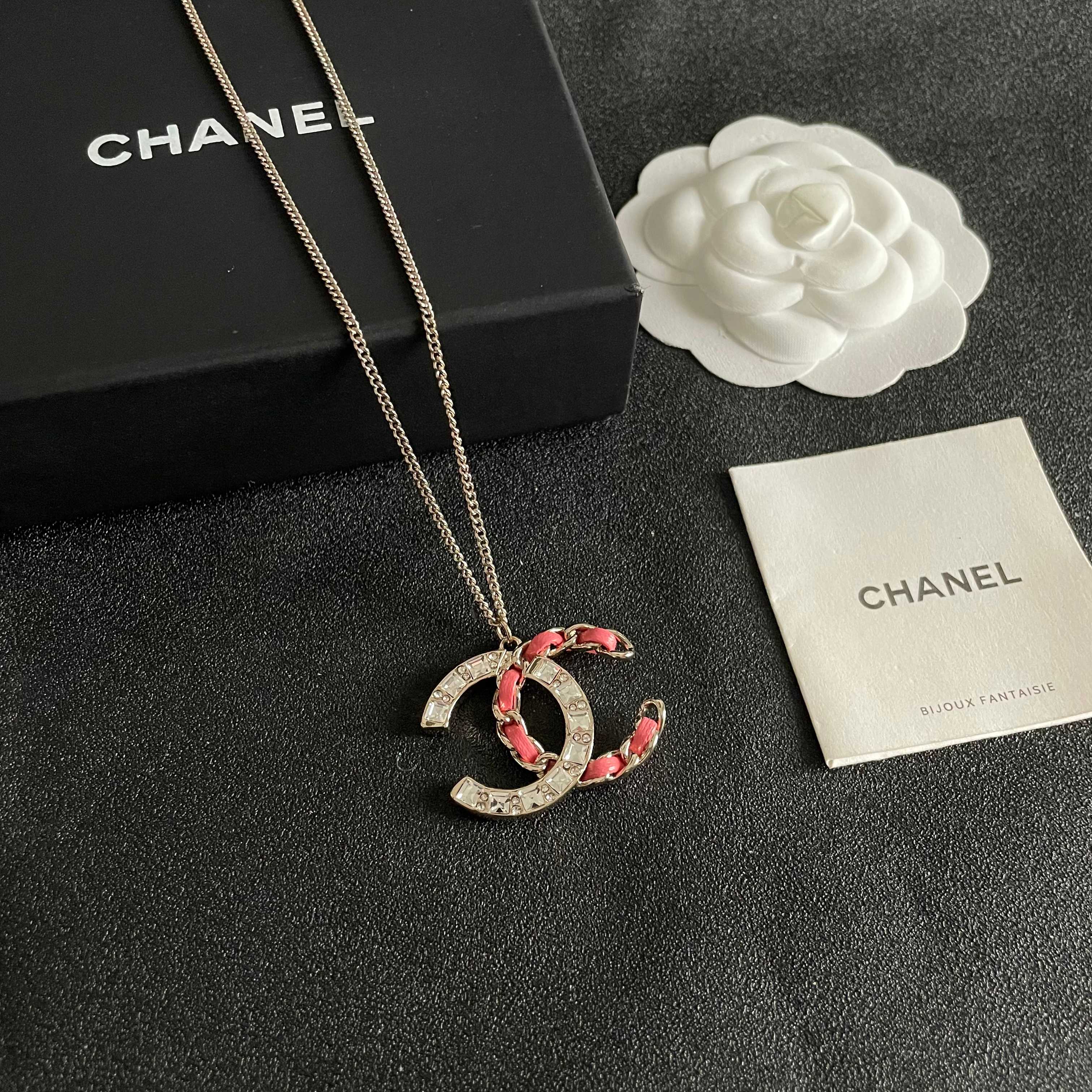 Chanel CC Logo Chain Woven Crystal Pendant Necklace necklace Light gold-tone metal with clear crystals and pink leather chain detailing 42cm