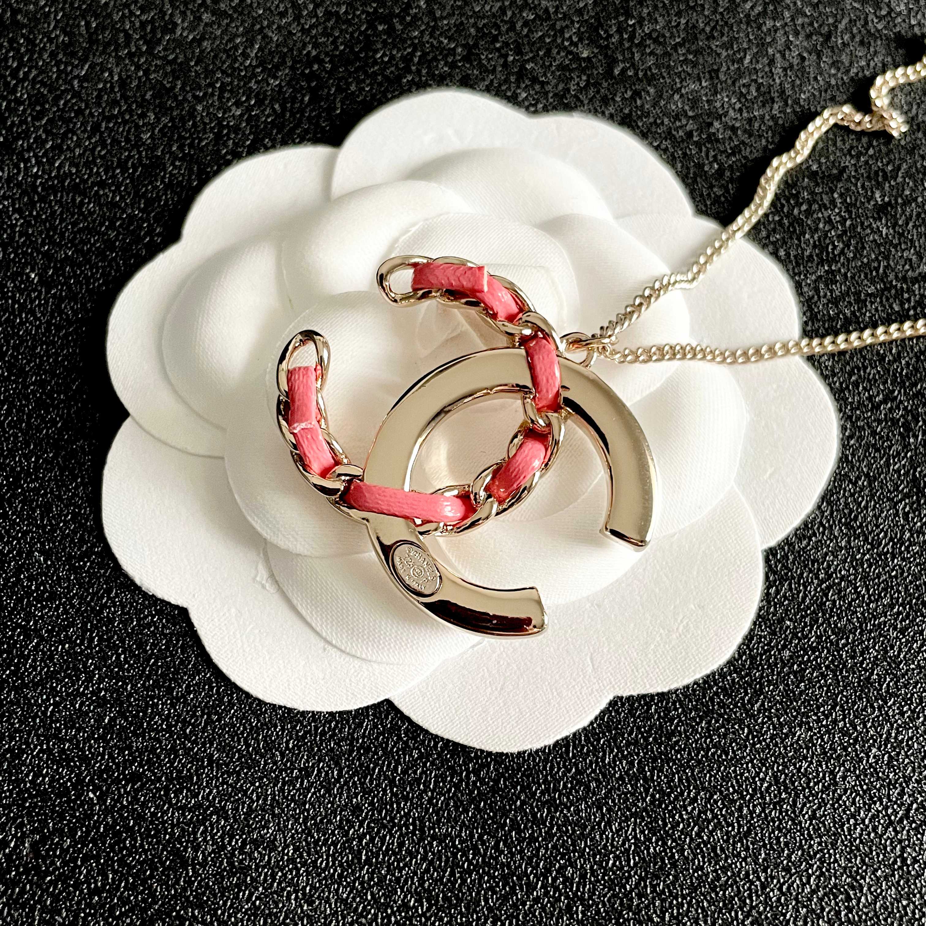 Chanel CC Logo Chain Woven Crystal Pendant Necklace necklace Light gold-tone metal with clear crystals and pink leather chain detailing 42cm