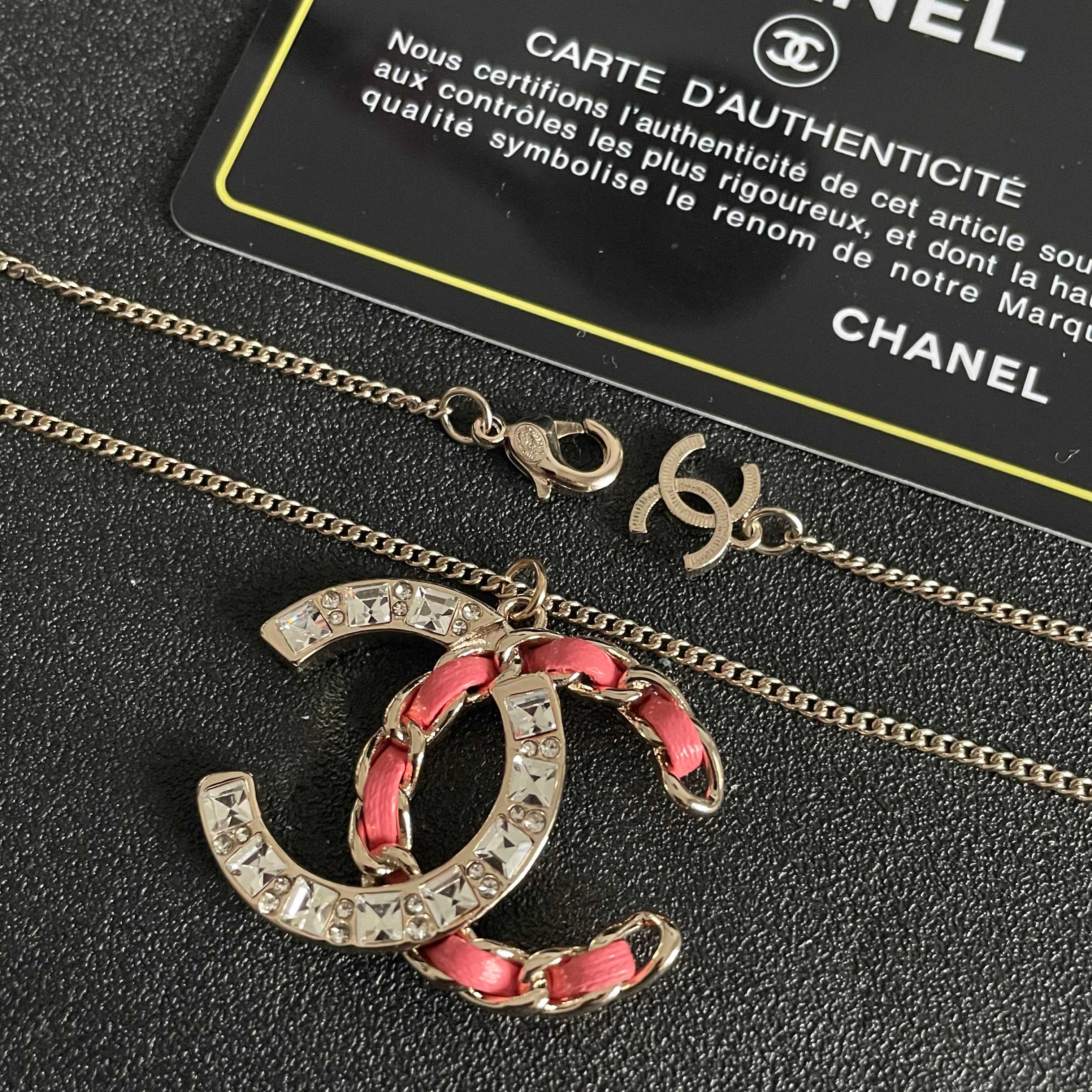 Chanel CC Logo Chain Woven Crystal Pendant Necklace necklace Light gold-tone metal with clear crystals and pink leather chain detailing 42cm