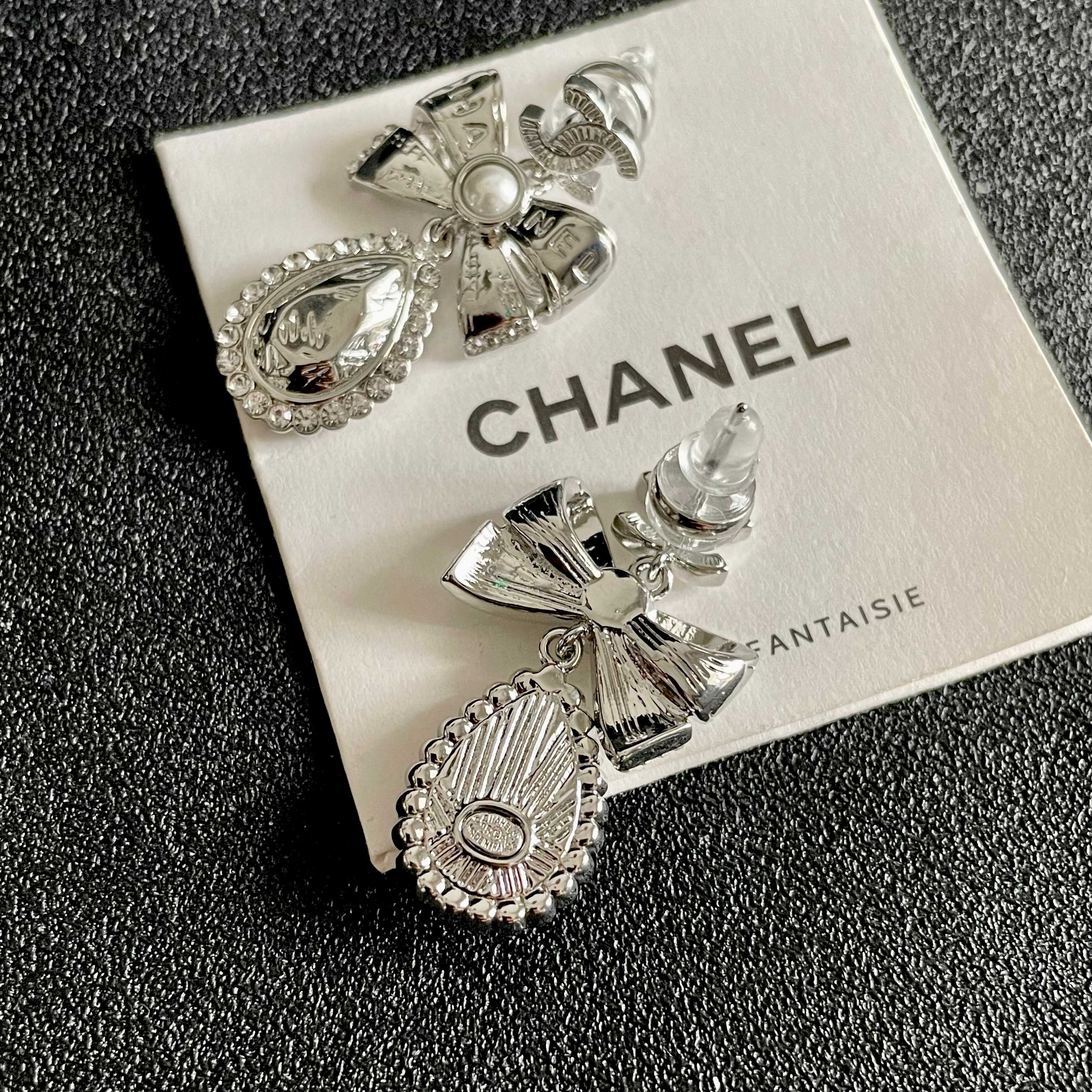 Chanel CC Bow Teardrop Crystal Pearl Drop Earrings earrings Silver-toned metal with white faux pearl and clear crystal accents Approximately 3 5cm drop length