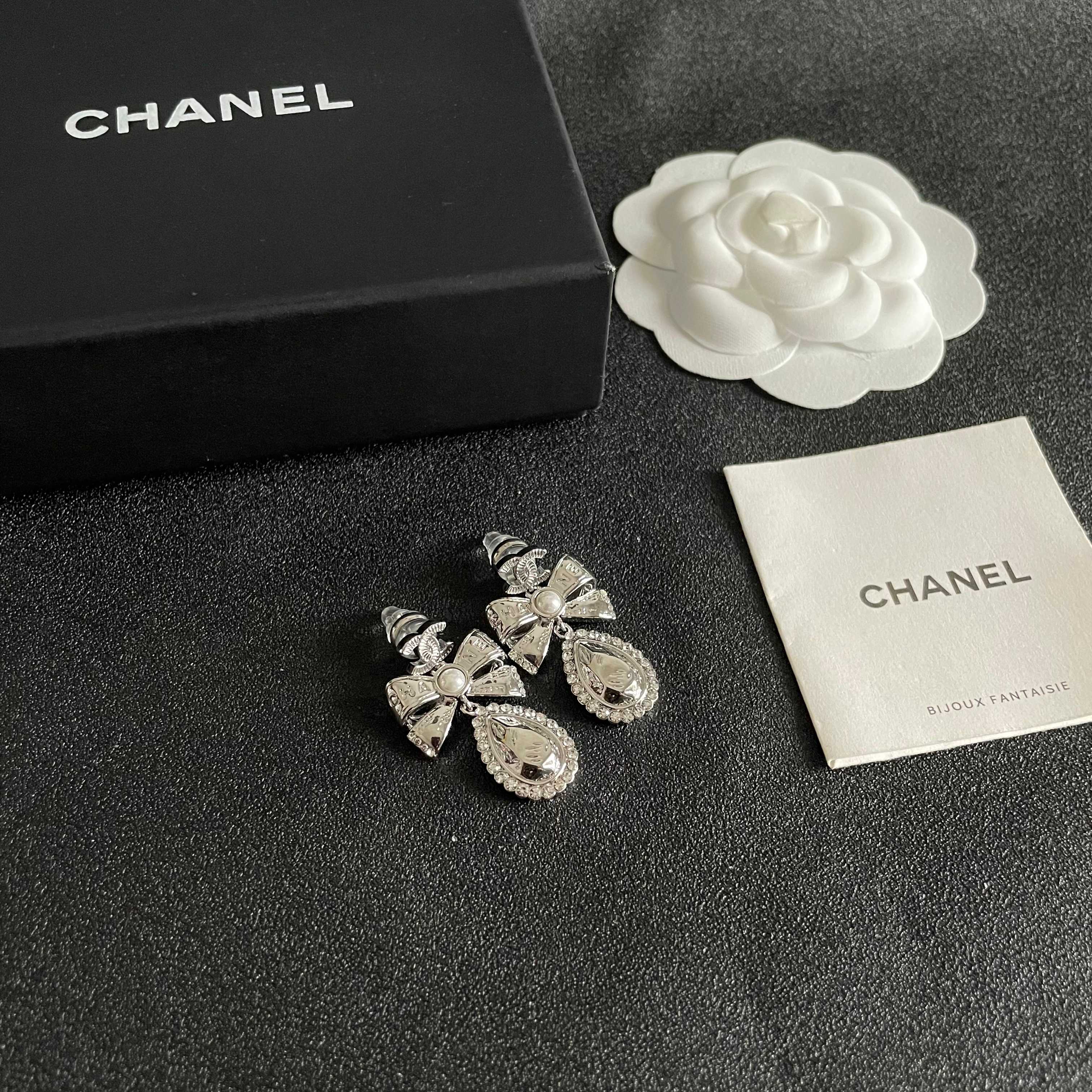 Chanel CC Bow Teardrop Crystal Pearl Drop Earrings earrings Silver-toned metal with white faux pearl and clear crystal accents Approximately 3 5cm drop length