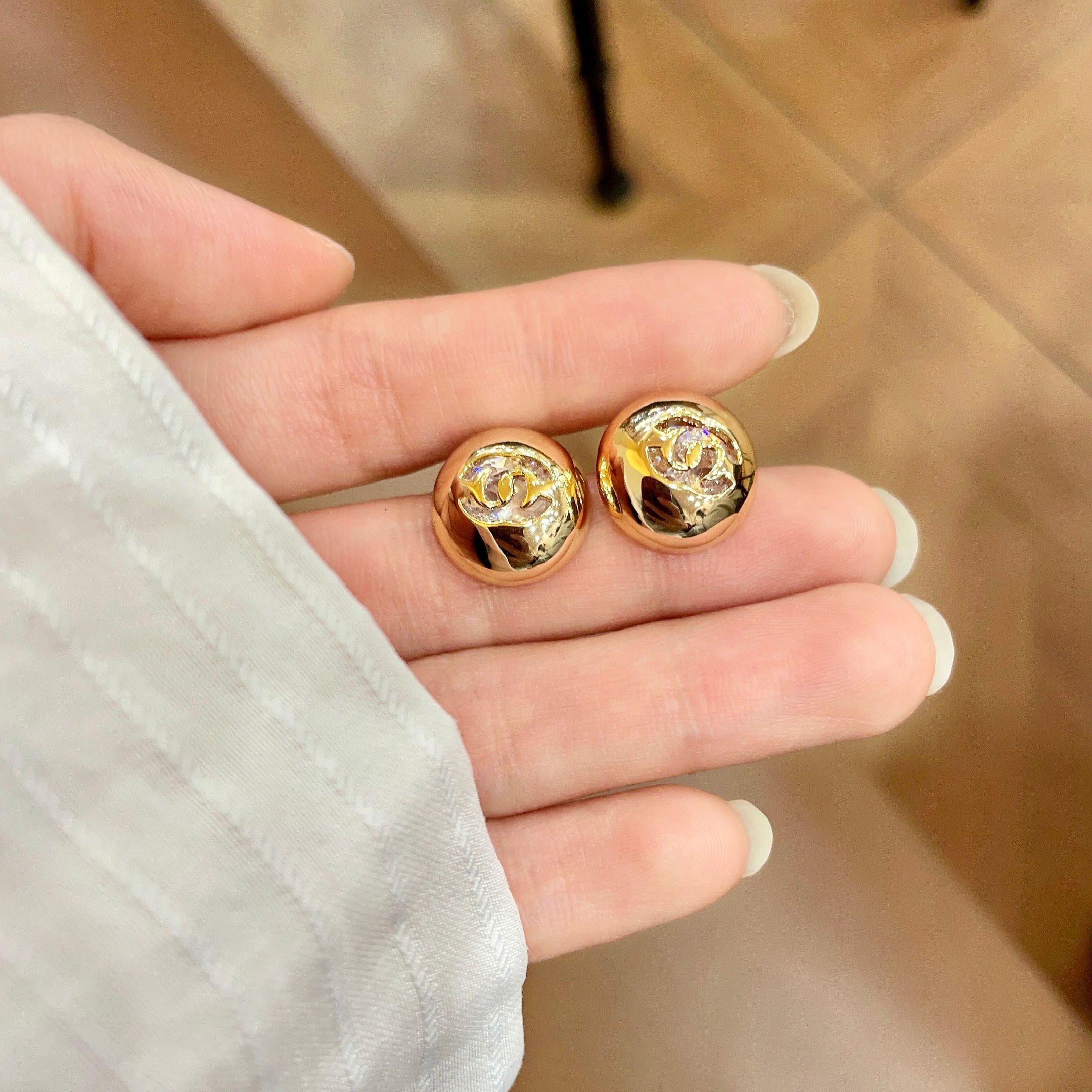 Chanel CC Logo Dome Stud Earrings earrings Gold-tone metal with clear crystal accents Silver-tone metal with clear crystal accents 12mm diameter