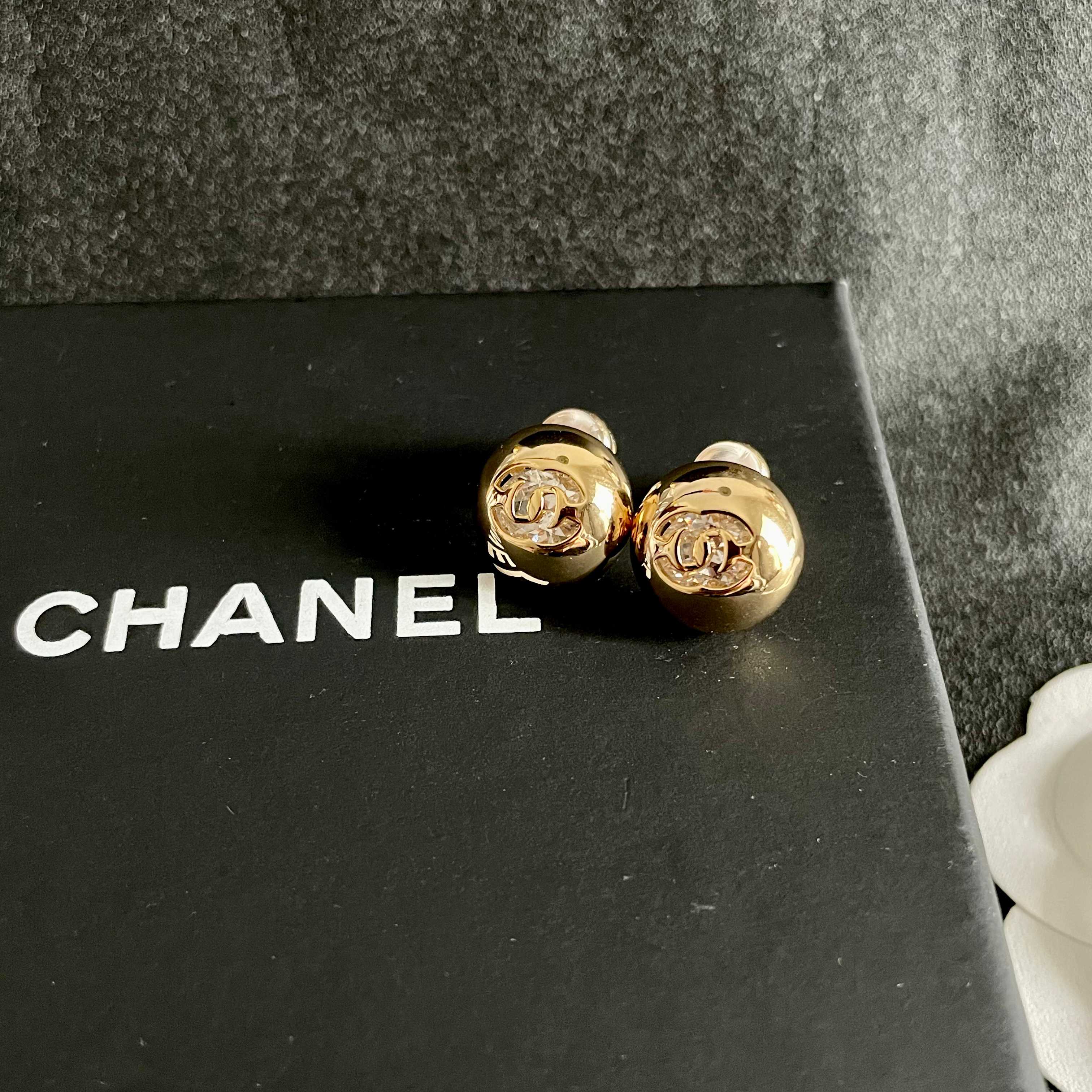 Chanel CC Logo Dome Stud Earrings earrings Gold-tone metal with clear crystal accents Silver-tone metal with clear crystal accents 12mm diameter
