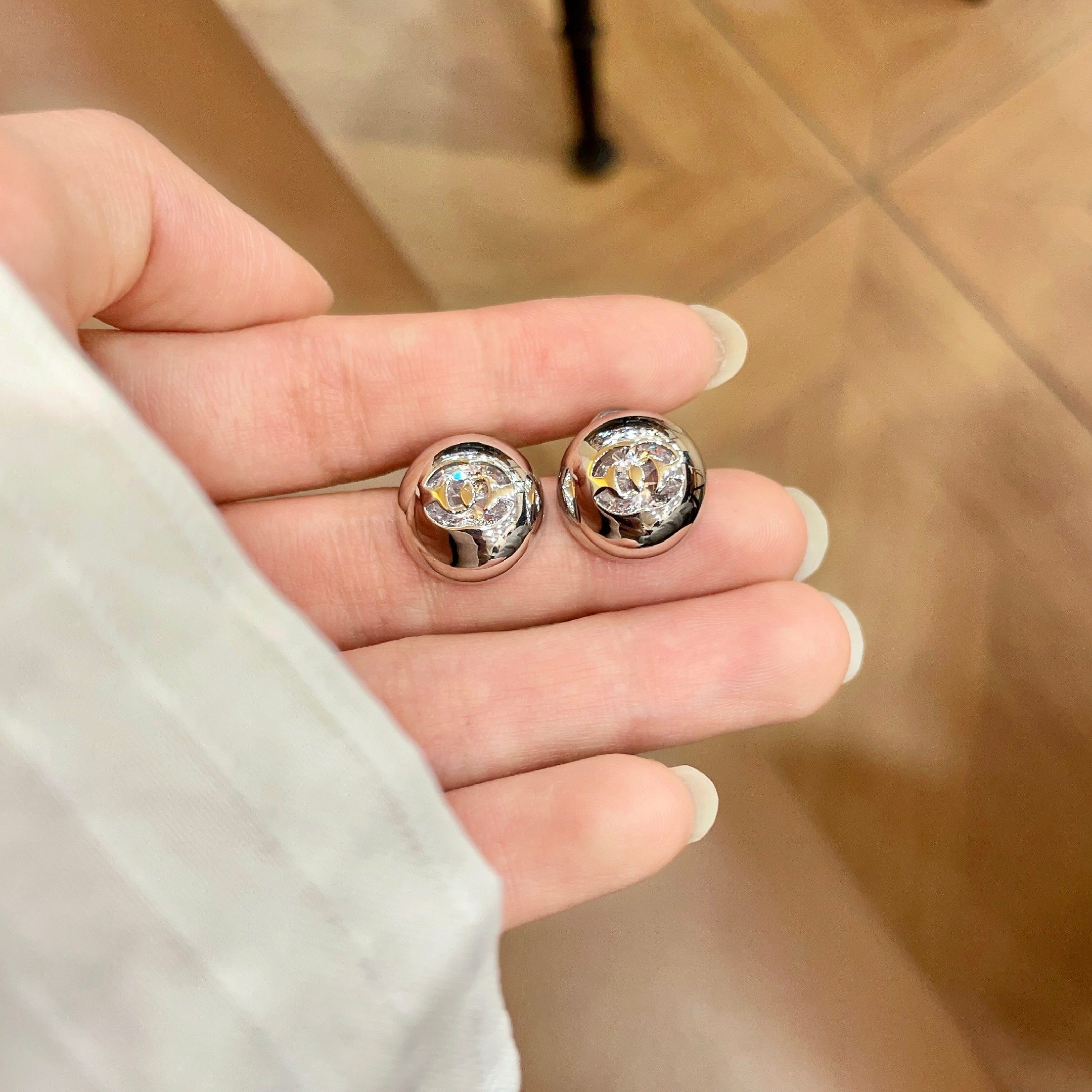 Chanel CC Logo Dome Stud Earrings earrings silver-tone metal with clear crystal accents 12mm diameter