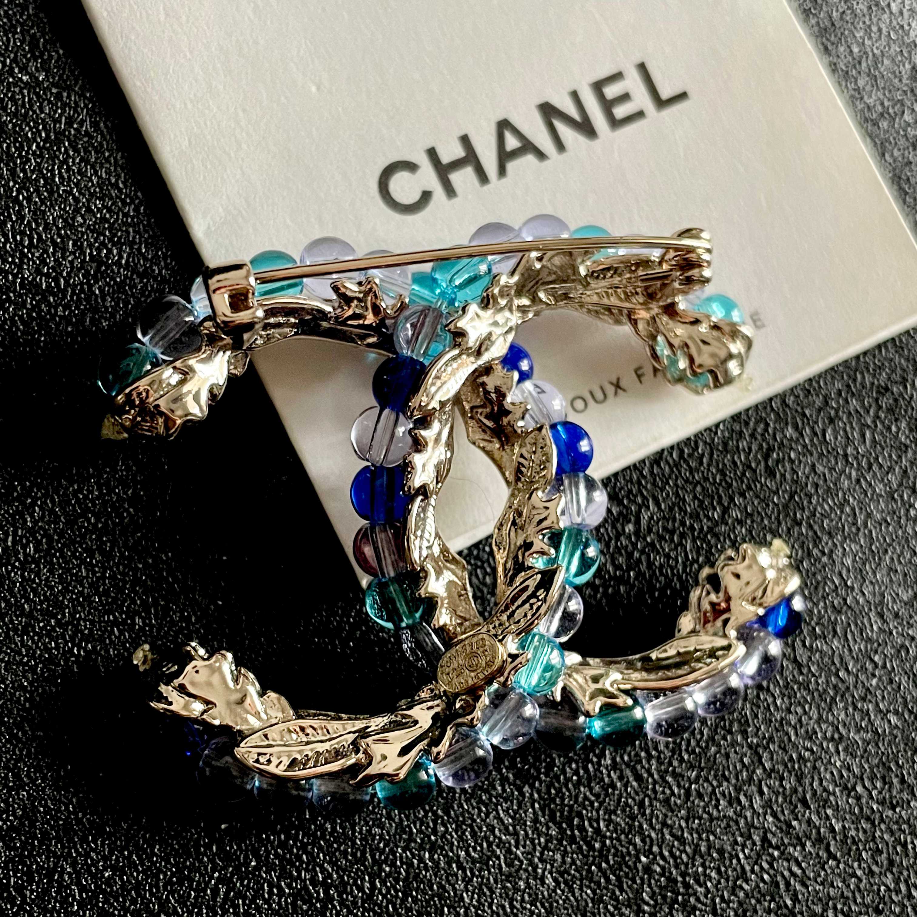 Chanel CC Logo Beaded Brooch brooch gold-tone metal with blue teal purple and pink glass beads 3 5cm width