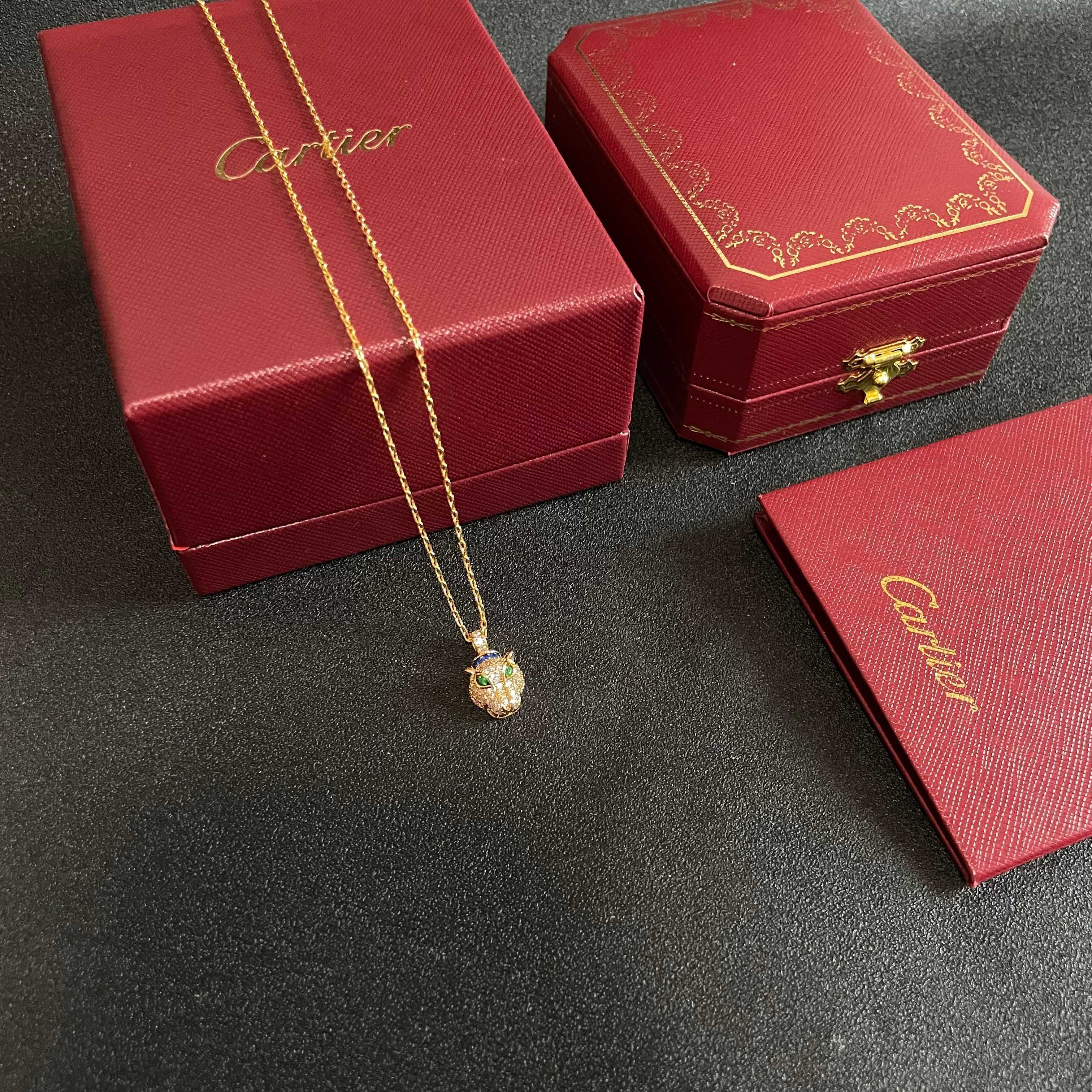 Cartier Panthere de Cartier necklace 18K yellow gold set with pave diamonds green tsavorite garnet eyes blue sapphire accents 40cm