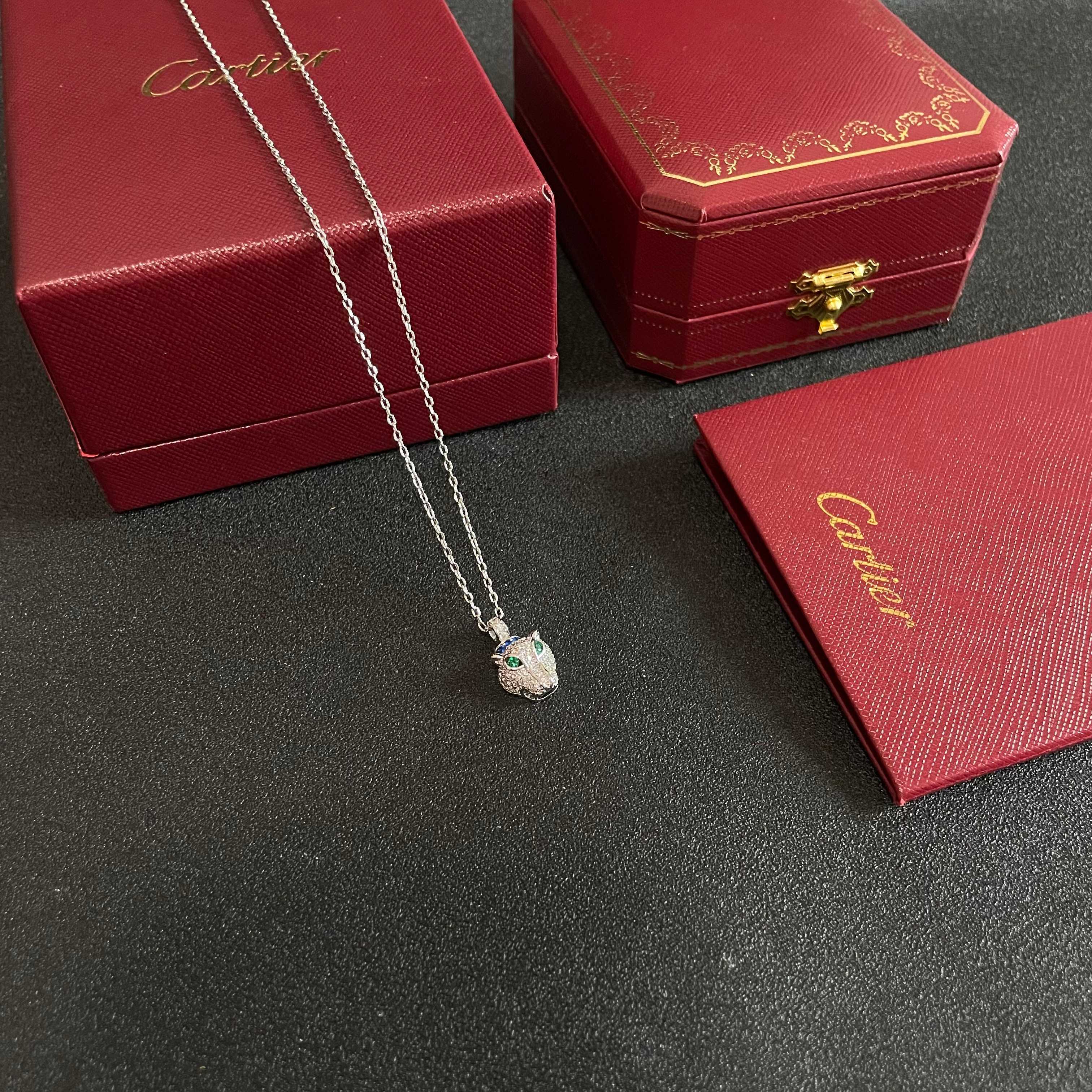 Cartier Panthere de Cartier necklace 18K white gold pave diamonds emerald eyes blue sapphire accent 42cm