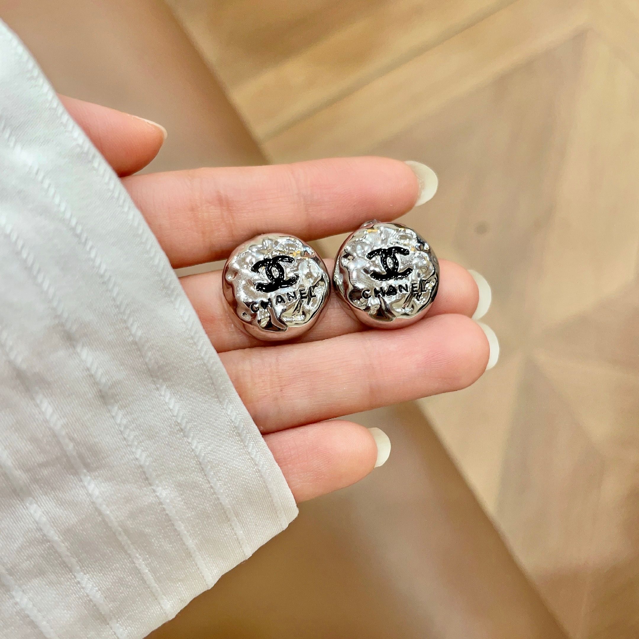 Chanel CC Logo Hammered Dome Stud Earrings earrings Silver-tone metal with black enamel CC logo detailing 1 5cm diameter