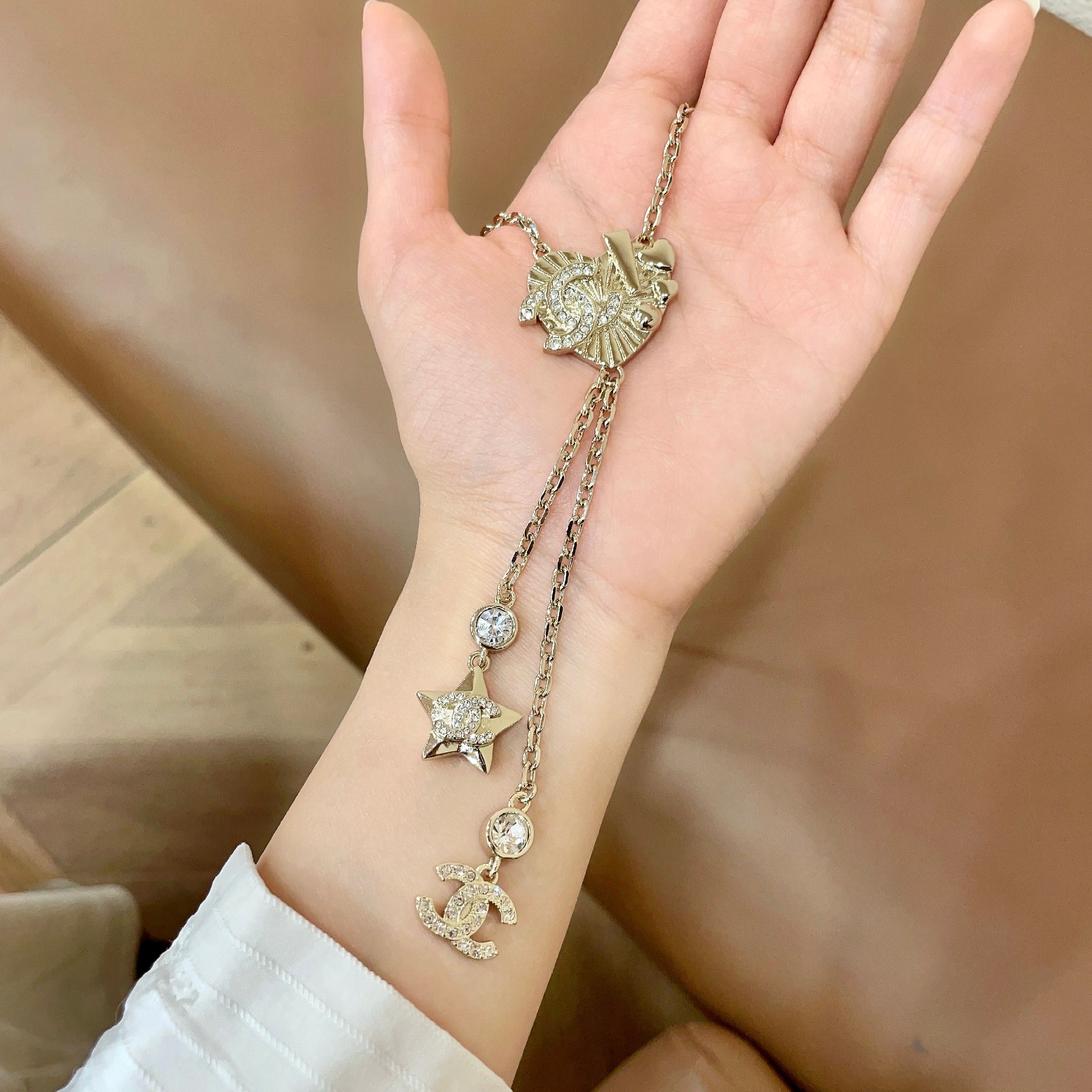 Chanel CC Heart Star Lariat necklace light gold metal with clear crystal accents 42cm