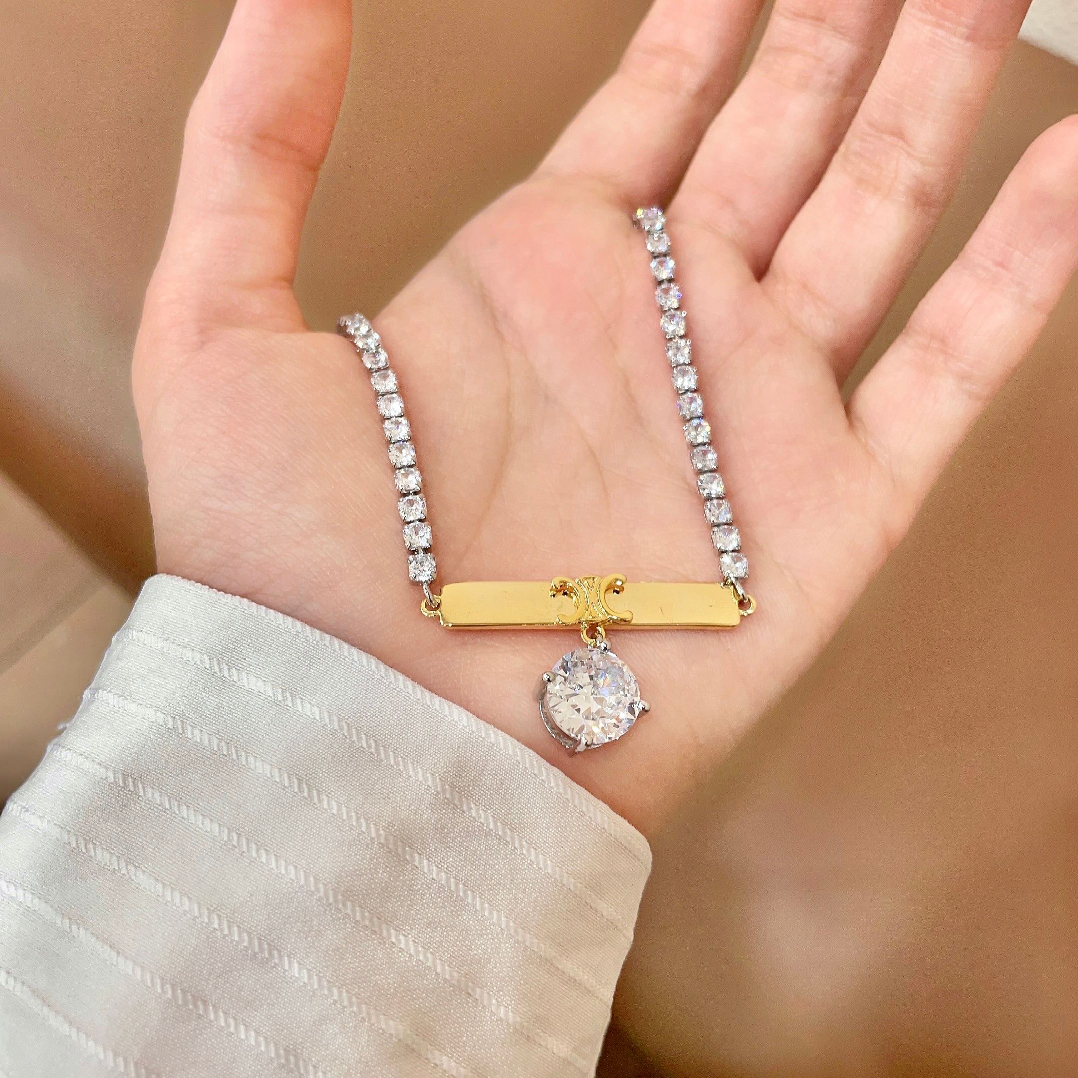 Celine Triomphe Bar Crystal Pendant Tennis Necklace necklace Two-tone silver-toned and gold-toned metal with clear faceted crystals 40cm