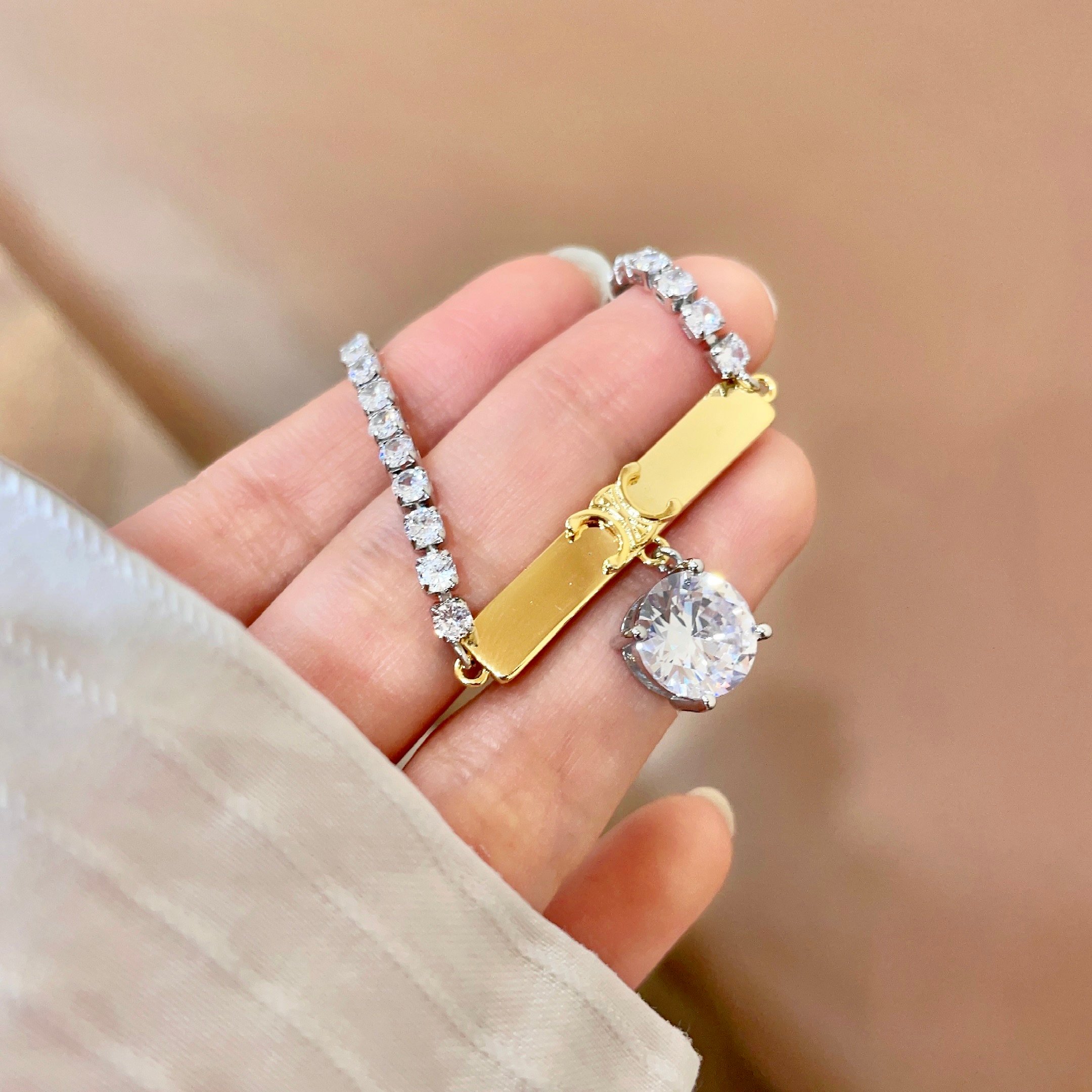 Celine Triomphe Crystal Charm Bracelet bracelet Two-tone gold and silver metal with clear faceted crystal stones 16cm with 5cm extender chain