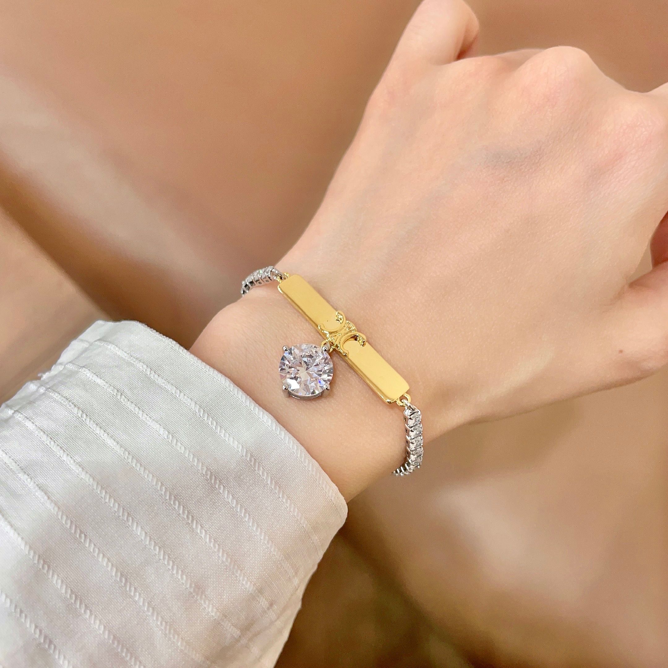 Celine Triomphe Crystal Charm Bracelet bracelet Two-tone gold and silver metal with clear faceted crystal stones 16cm with 5cm extender chain