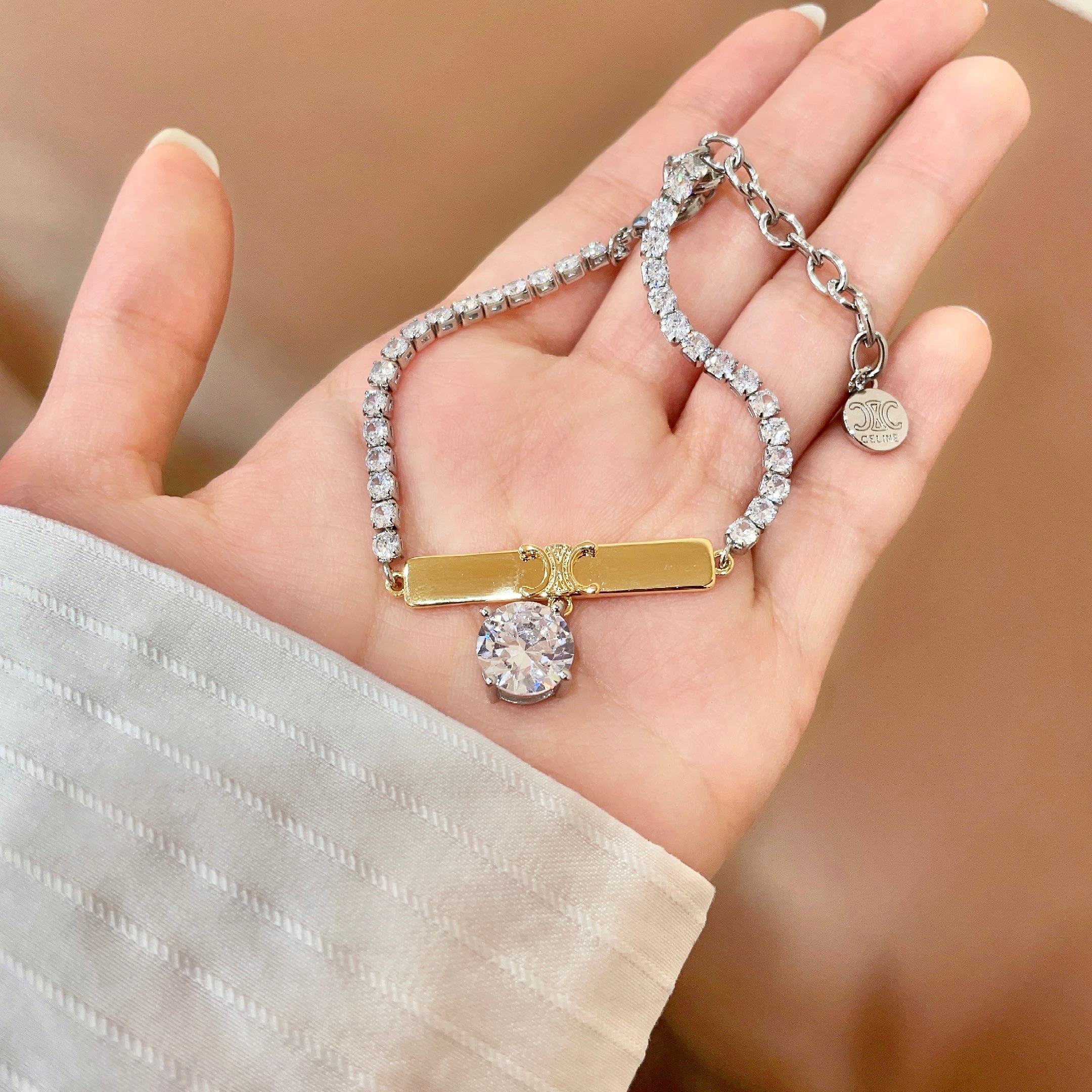 Celine Triomphe Crystal Charm Bracelet bracelet Two-tone gold and silver metal with clear faceted crystal stones 16cm with 5cm extender chain