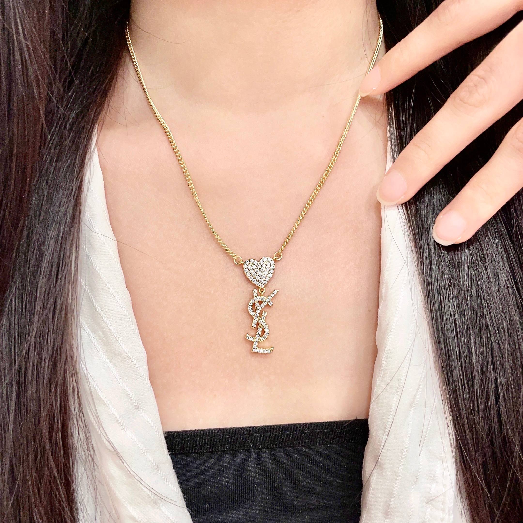 Saint Laurent 1961 Heart Monogram Pendant necklace Gold-tone metal with clear pave crystals 45cm